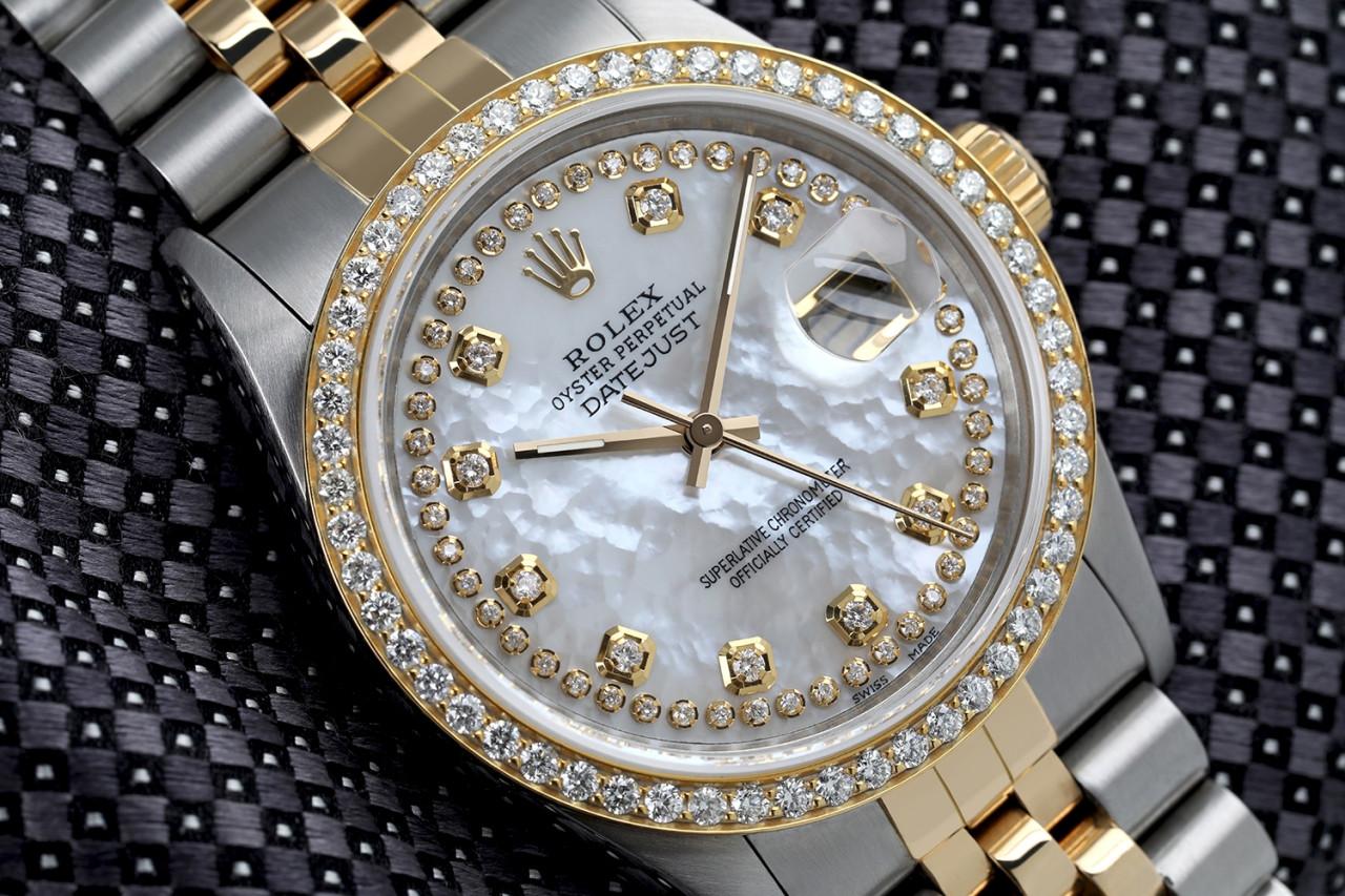 Rolex 36mm Datejust Diamond Bezel White Mother of Pearl String Diamond Dial Jubilee Band 16013.
This watch is in like new condition. It has been polished, serviced and has no visible scratches or blemishes. All our watches come with a standard 1