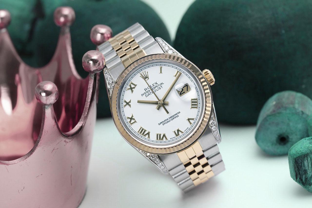 

We take great pride in presenting this timepiece, which is in impeccable condition, having undergone professional polishing and servicing to maintain its pristine appearance. The watch features aftermarket diamonds (non-Rolex), and there are no