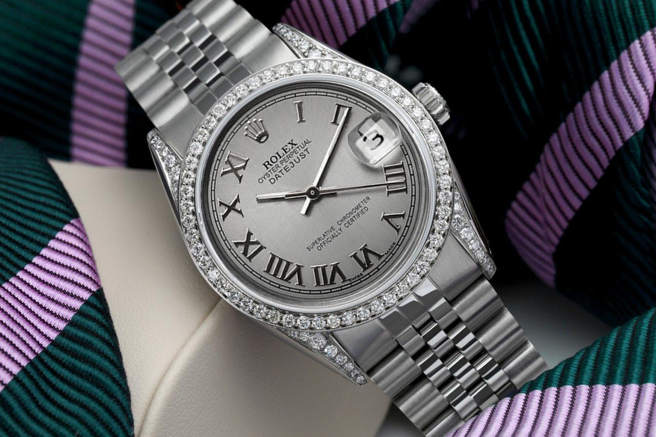We take great pride in presenting this timepiece, which is in impeccable condition, having undergone professional polishing and servicing to maintain its pristine appearance. The watch features aftermarket diamonds (non-Rolex), and there are no