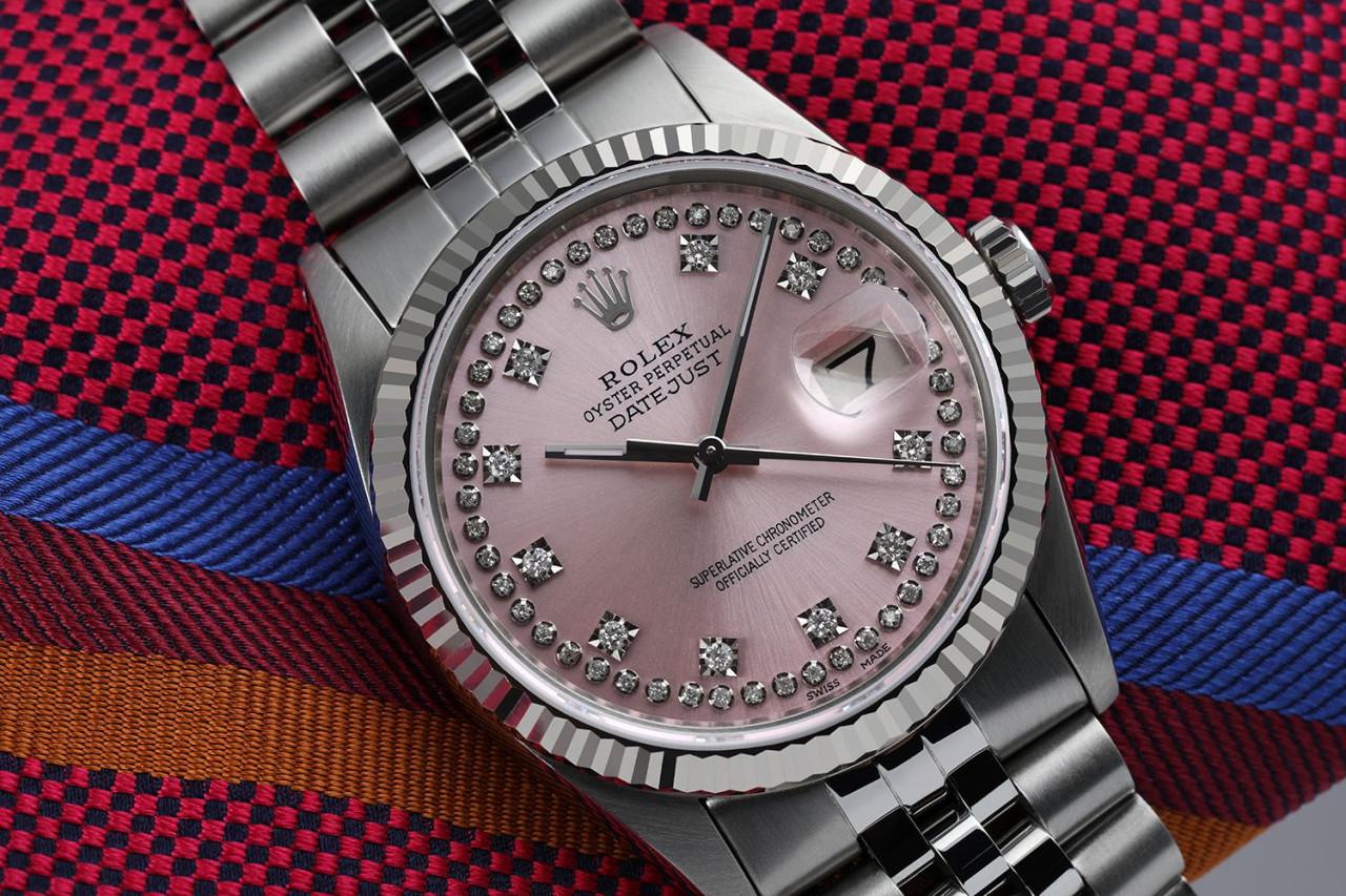 Rolex 36mm Datejust Pink Dial with Round Diamond Numbers Oyster Perpetual Watch 16014.
This watch is in like new condition. It has been polished, serviced and has no visible scratches or blemishes. All our watches come with a standard 1 year