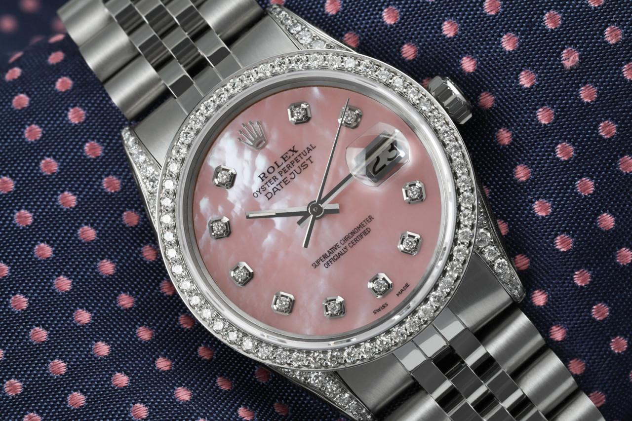 Rolex 36mm Datejust Pink Mother Of Pearl Dial Custom Set Diamond Bezel & Lugs Jubilee Bracelet 16014.
This watch is in like new condition. It has been polished, serviced and has no visible scratches or blemishes. All our watches come with a standard