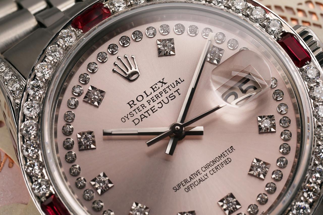 Rolex 36mm Datejust Ruby & Diamond Bezel with Pink Two Row Diamond Dial Jubilee Bracelet 16014.
This watch is in like new condition. It has been polished, serviced and has no visible scratches or blemishes. All our watches come with a standard 1