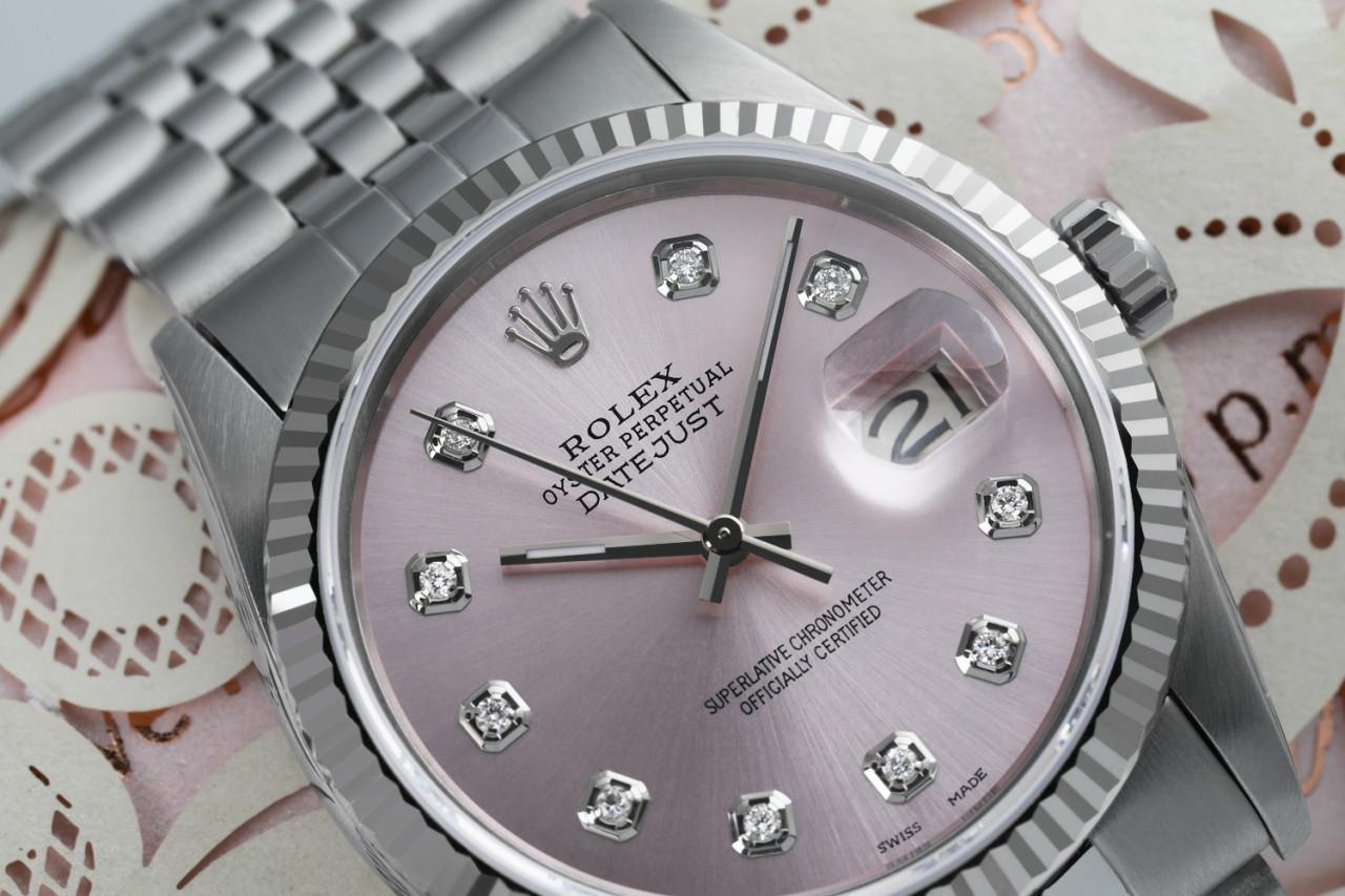 Rolex 36mm Datejust Stainless Steel Metallic Pink Diamond Dial Deployment buckle 16014.
This watch is in like new condition. It has been polished, serviced and has no visible scratches or blemishes. All our watches come with a standard 1 year