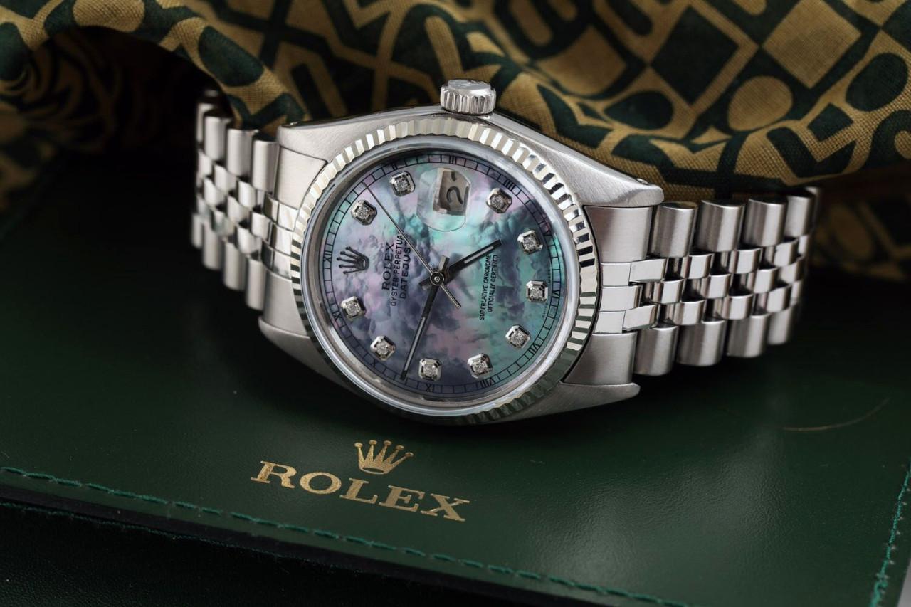 Rolex 36mm Datejust Tahitian Mother of Pearl Diamond Dial Deployment Jubilee Buckle 16030.
This watch is in like new condition. It has been polished, serviced and has no visible scratches or blemishes. All our watches come with a standard 1 year