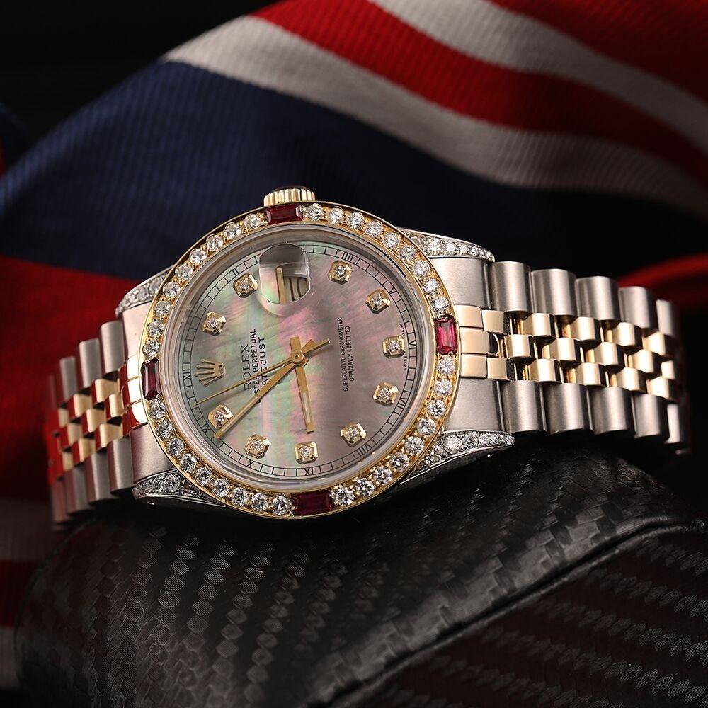 Men's Rolex 36mm Datejust Two Tone Jubilee Black MOP Mother Of Pearl Dial Diamond Accent RT Bezel + Lugs + Rubies 16013.
This watch is in like new condition. It has been polished, serviced and has no visible scratches or blemishes. All our watches
