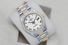 Rolex Montre à bracelet Oyster 36 mm avec cadran romain blanc et lunette en diamants, bicolore