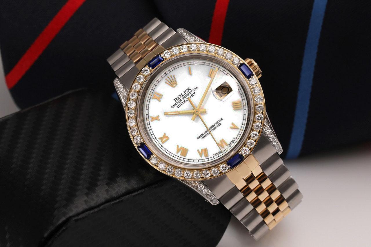  We take great pride in presenting this timepiece, which is in impeccable condition, having undergone professional polishing and servicing to maintain its pristine appearance. The watch features aftermarket diamonds (non-Rolex), and there are no