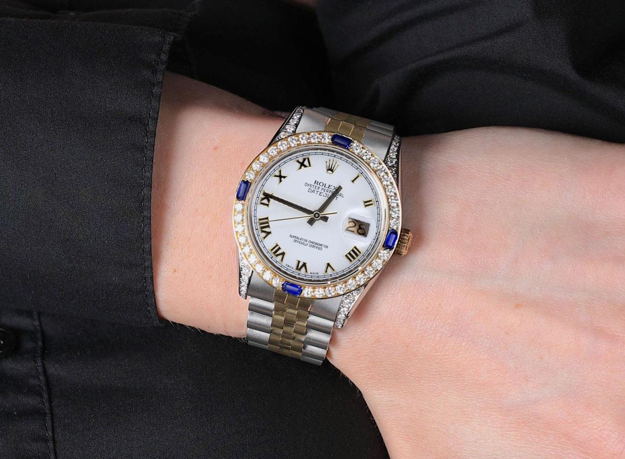 Rolex 36mm Datejust White Roman Dial Two Tone Watch with Blue Sapphires 

We take great pride in presenting this timepiece, which is in impeccable condition, having undergone professional polishing and servicing to maintain its pristine appearance.