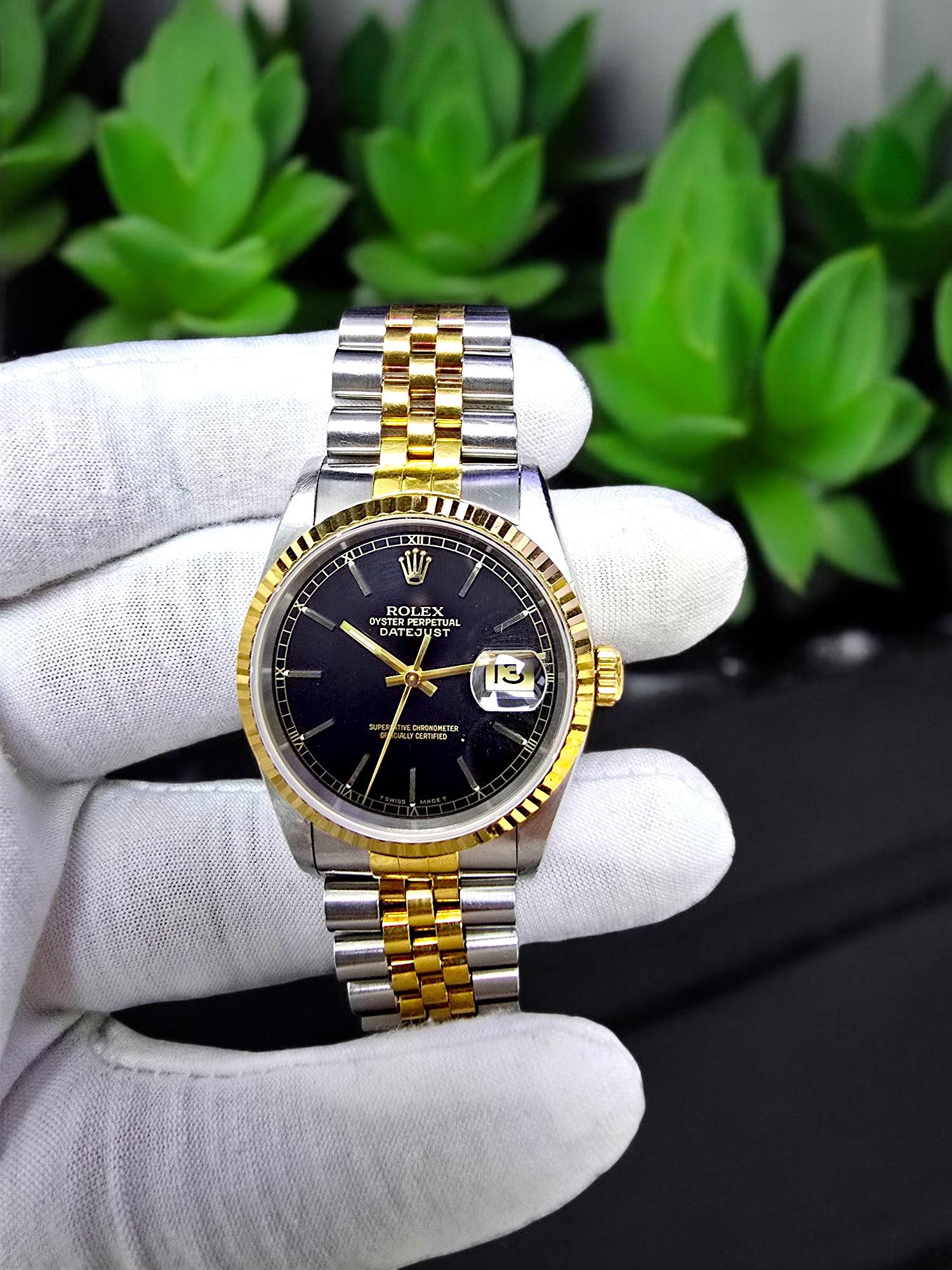 Rolex Oyster Perpetual Datejust Black Dial Movement 16233 62523H-18 Automatic winding 18K Gold and Stainless Steel (36mm Dial Size). Jubilee Bracelet, silver and gold color. Superlative Chronometer, Officially Certified. With magnified date. Made in