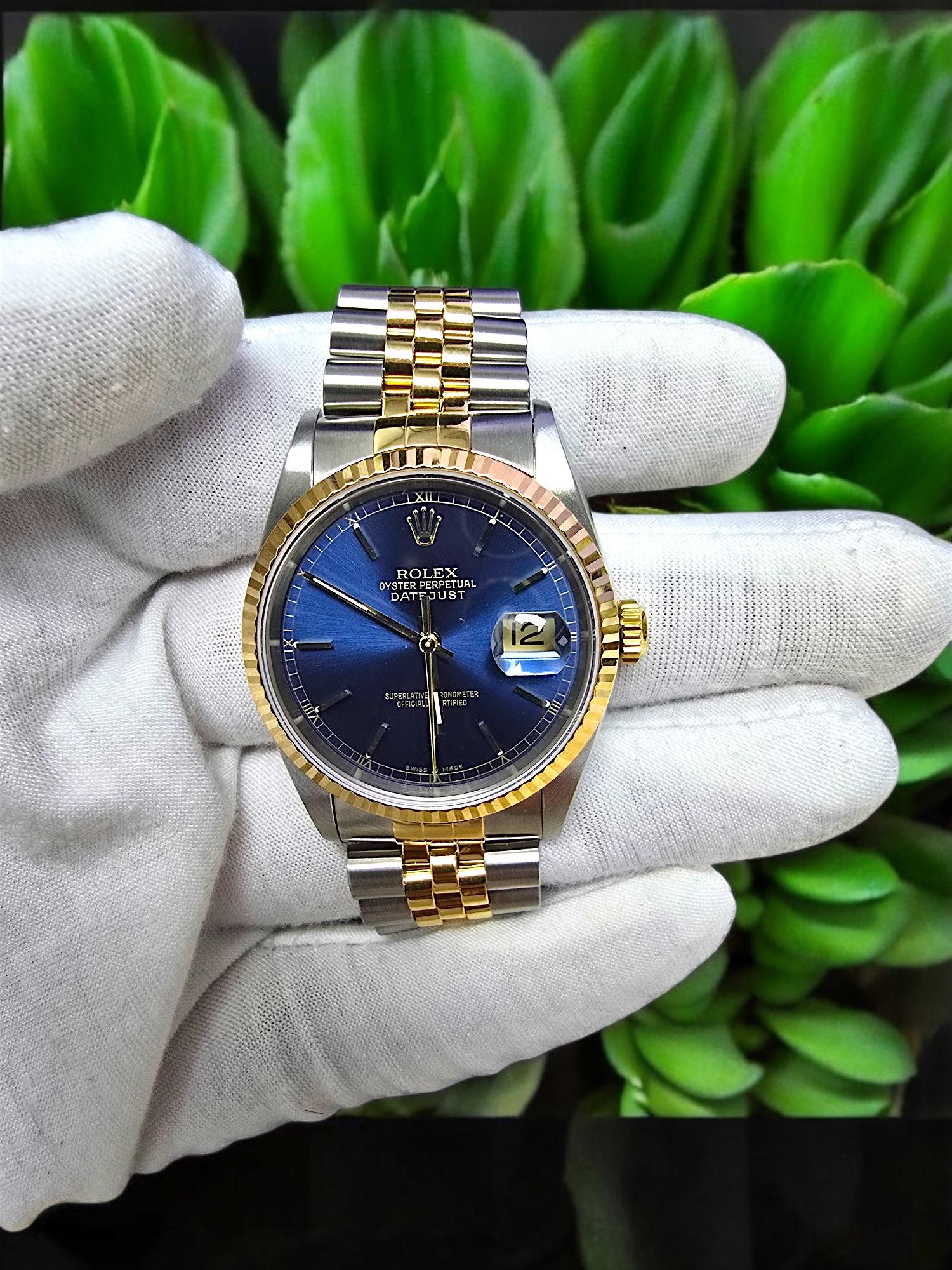 Rolex Oyster Perpetual Datejust Blue Dial Movement 16233 62523H-18 Automatic winding 18K Gold and Stainless Steel (36mm Dial Size). Jubilee Bracelet, silver and gold color. Superlative Chronometer, Officially Certified. With magnified date. Made in