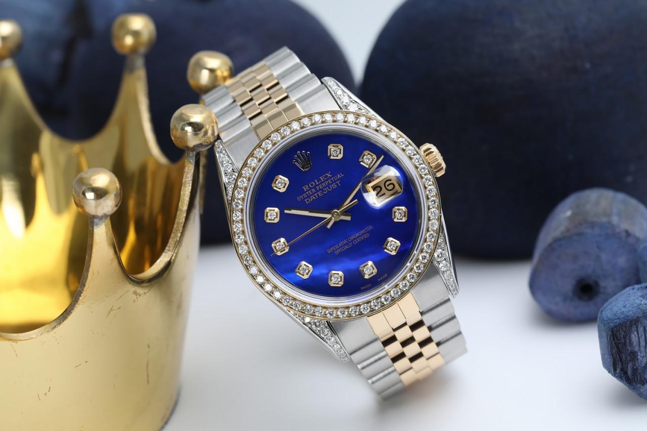 Rolex 36mm Oyster Perpetual Datejust Diamond Bezel & Lugs Blue Mother Of Pearl Diamond Dial 16013
This watch is in like new condition. It has been polished, serviced and has no visible scratches or blemishes. All our watches come with a standard 1
