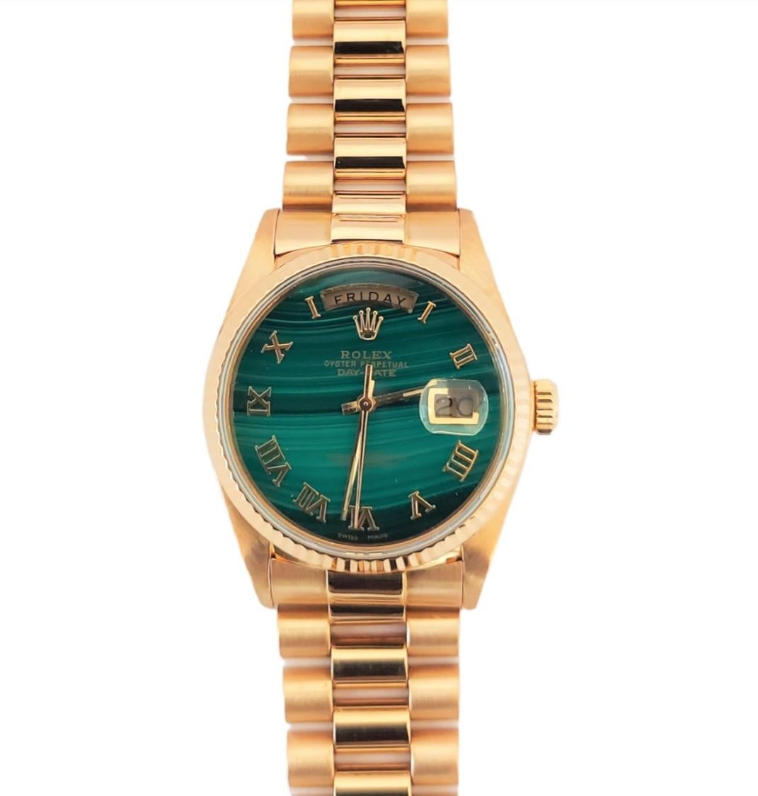 (Watch Description) 
Brand - Rolex
Gender - Mens
Model - 18038 President/Day-DATE
Metals - Yellow solid Gold
Case size - 36mm
Bezel - Yellow gold Fluted
Crystal - Sapphire
Movement - Automatic Cal.3055
Dial - Black stick 
Wrist band - Yellow solid