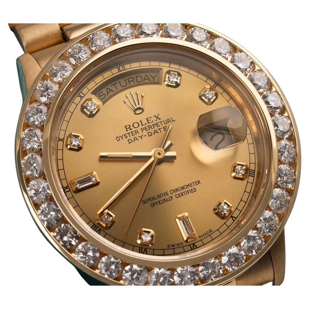 Rolex Montre présidentielle en or 18 carats avec cadran champagne baguette et lunette en diamants