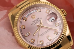 Rolex Presidential 18kt Gold Pink Baguette Diamond Dial Fluted Bezel 18038