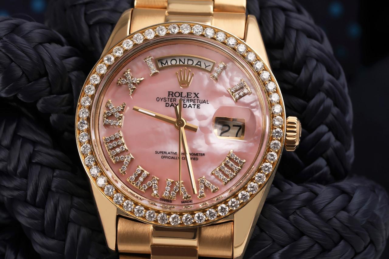 Rolex 36mm Presidential 18kt Gold Pink MOP Roman Diamond Numeral Dial Diamond Bezel 18038.

This watch is in like new condition. It has been polished, serviced and has no visible scratches or blemishes. All our watches come with a standard 1 year