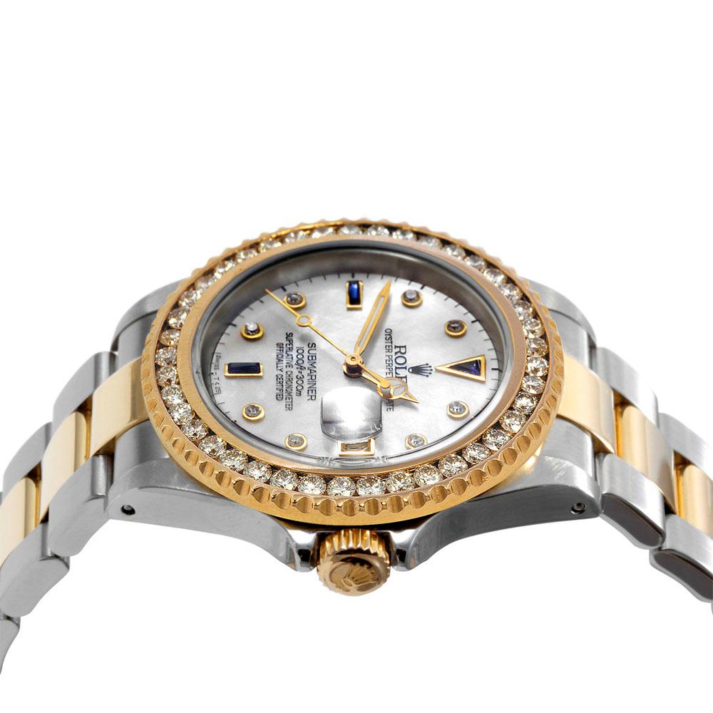 Brand - Rolex
Model - 16610 
Style - Submariner
Metals - yellow gold / stainless steel 
Bezel - Custom 1.5CT Yellow gold Diamond
Crstal - Sapphire
Dial -  Custom Sapphire/Diamond-MP
Movement - Rolex Cal-3135
Band - Two tone Oyster