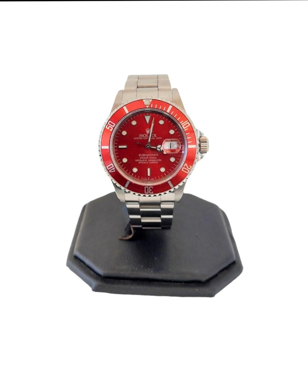 (Watch Description)
Brand - Rolex
Condition - Preowned 
Model - 16610 Submariner 
Case size - 41mm
Dial - Custom red Sub
Bezel - Rotating steel Red
Crystal - Sapphire 
Movement - Rolex Cal-3135 
Wrist band - Oyster Steel 
Wrist size - 8 inches 


