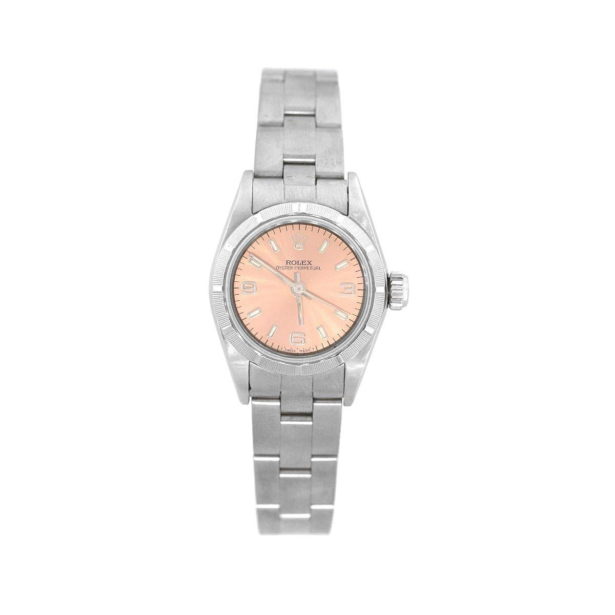 Brand: Rolex
MPN: 67230
Model: Oyster Perpetual
Case Material: Stainless Steel
Case Diameter: 24mm
Bezel:Stainless steel bezel
Dial: Salmon dial with both silver arabic and stick hour markers.
Bracelet: stainless steel oyster bracelet
Crystal: