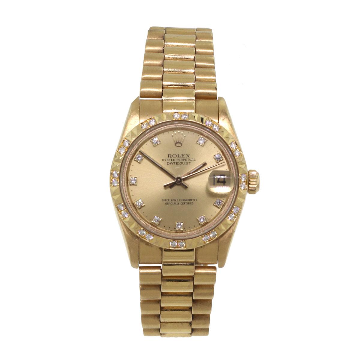 Brand: Rolex
MPN: 68258
Model: Datejust
Case Material: 18k Yellow Gold
Case Diameter: 31mm
Bezel: 18k Yellow Gold Diamond Bezel
Dial: Champagne dial with diamond hour markers. Date can be found at 3 0'clock
Bracelet: 18k Yellow Gold presidential