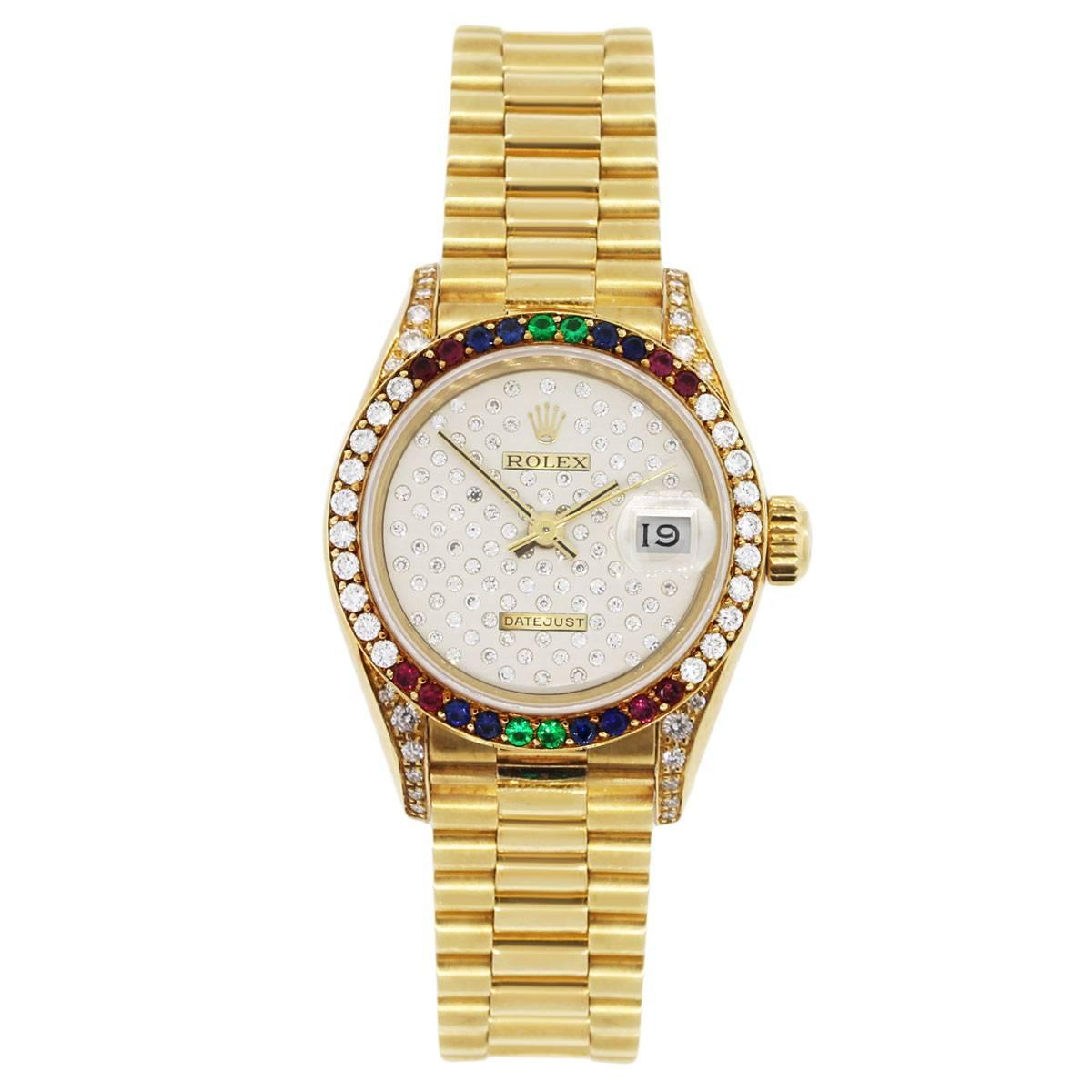 Brand: Rolex
MPN: 69038
Model: Datejust
Case Material: 18k yellow gold
Case Diameter: 26mm
Crystal: Scratch resistant sapphire
Bezel: Round shape diamond, ruby, emerald and sapphire bezel (factory)
Dial: Very rare champagne pleade diamond dial with