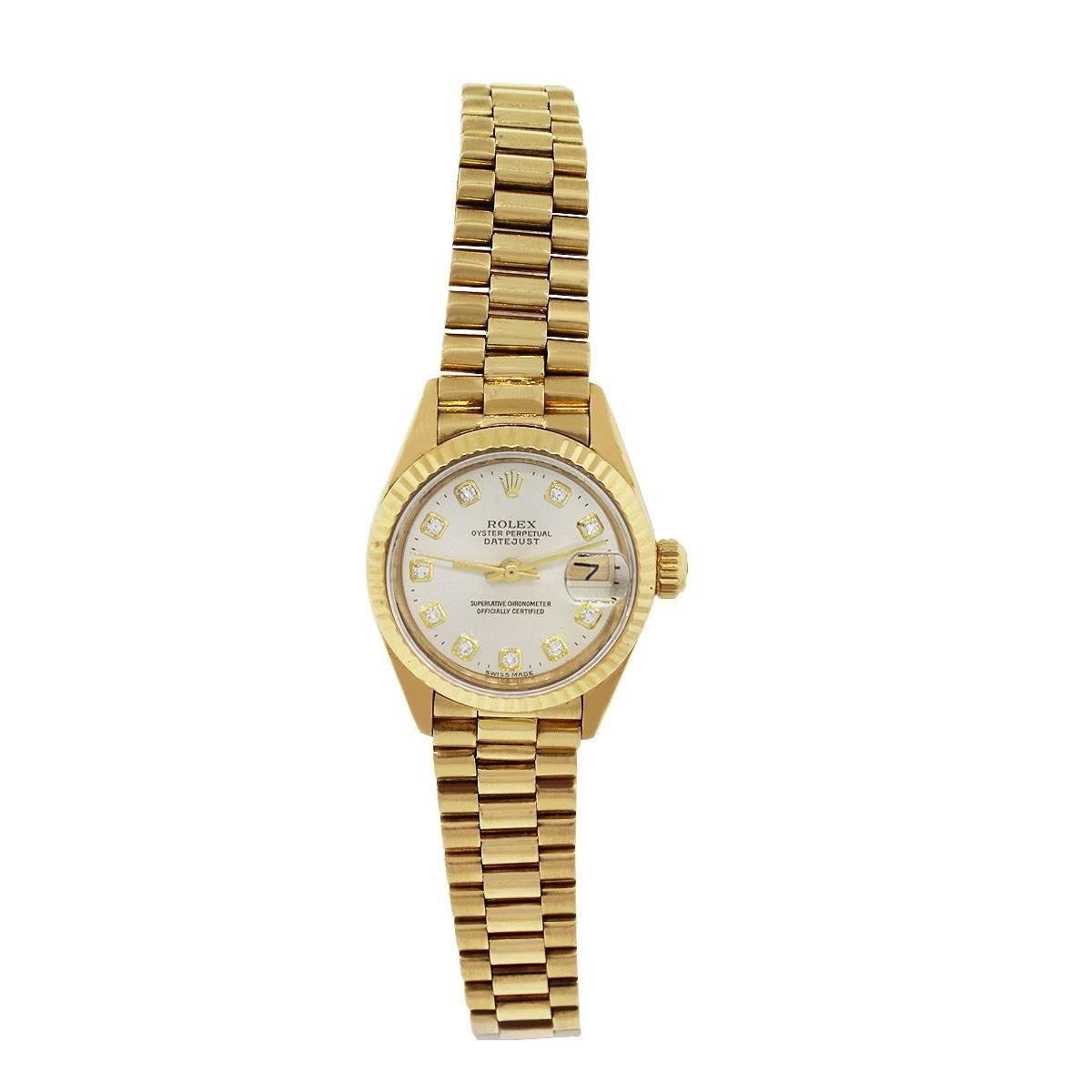 Brand: Rolex
MPN: 6916
Model: Datejust
Case Material: 18k Yellow Gold
Crystal: Sapphire
Case Diameter: 26mm
Bezel: Fixed Fluted bezel
Dial: Champagne Dial with Diamond markers. Date at 3 o’clock 
Bracelet :18k Presidential band
Size: Will fit a 6″