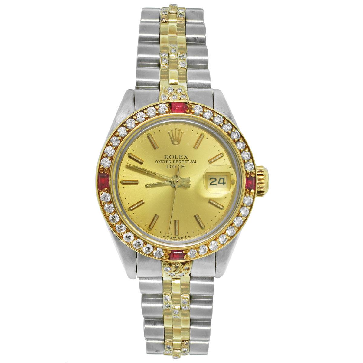 Brand: Rolex
MPN: 6917
Model: Date
Case Material: Stainless Steel
Crystal: Sapphire
Bezel: 18k Yellow Gold ruby and diamond bezel (aftermarket)
Dial: Champagne dial with gold stick hour markers and hands; Date at 3 o'clock. (factory)
Bracelet: Two