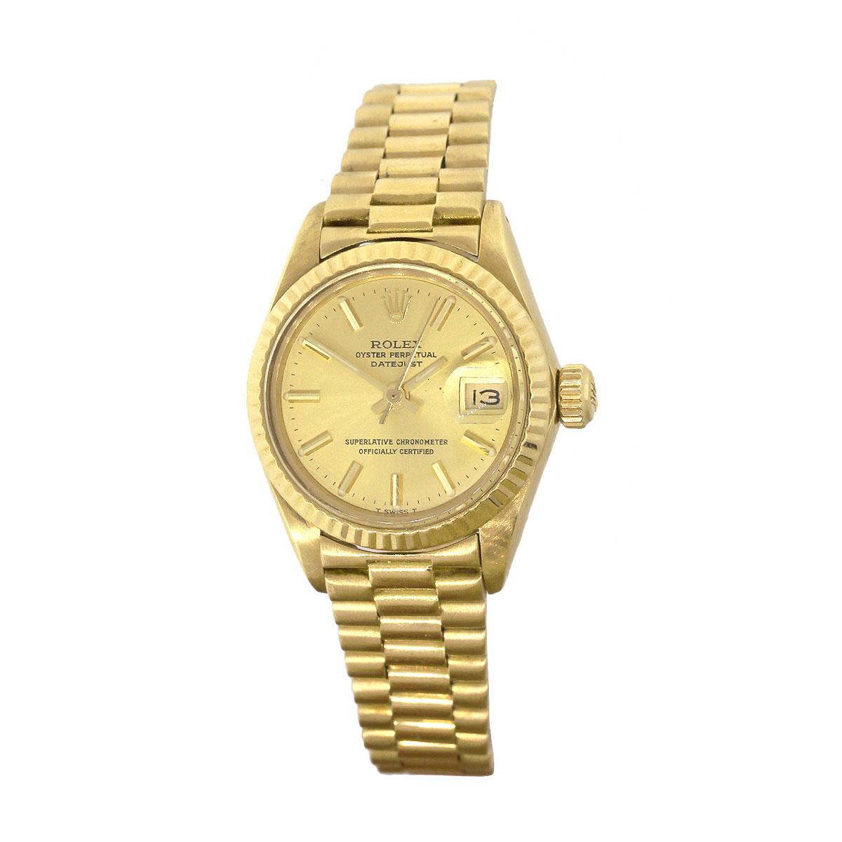Brand: Rolex
MPN: 6917
Model: Datejust
Case Material: 18k yellow gold
Case Diameter: 26mm
Crystal: Plastic
Bezel: 18k Yellow Gold fluted bezel
Dial: Gold dial with gold stick dial markers and hands, date is displayed at 3 O’clock
Bracelet: 18k