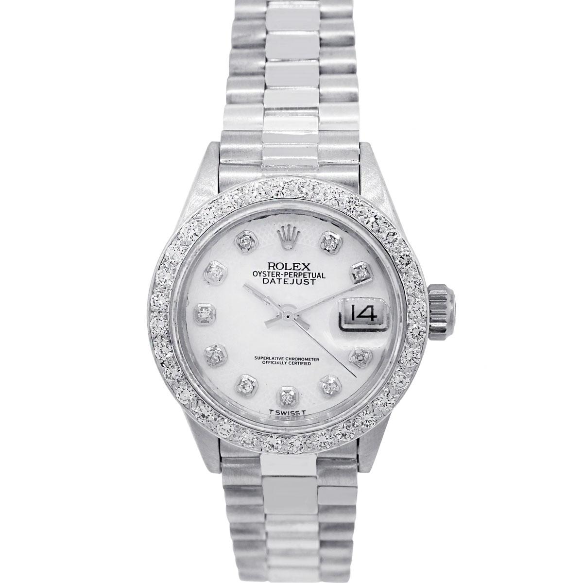 Brand: Rolex
MPN	: 6917
Model: Presidential
Case Material: 18k white gold
Case Diameter: 26mm
Crystal: Scratch resistant sapphire
Bezel: Aftermarket Diamond Bezel
Dial: Aftermarket Mother of Pearl dial with guilloche border, Diamond hour markers and