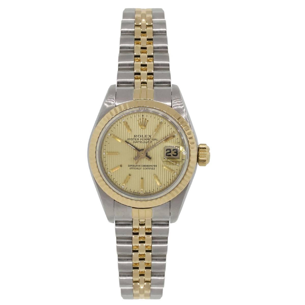 Brand: Rolex
MPN: 69173
Model: Datejust
Case Material: Stainless steel
Case Diameter: 26mm
Crystal: Scratch resistant sapphire
Bezel: 18k yellow gold fluted bezel
Dial: Tapestry champagne dial with gold hands and hour markers, date window at the 3