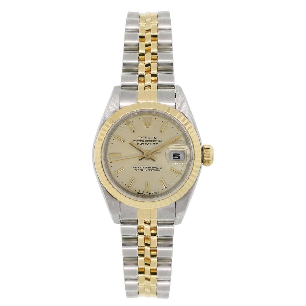 Brand: Rolex
MPN: 69173
Model: Datejust
Case Material: Stainless steel
Case Diameter: 26mm
Crystal: Scratch resistant sapphire
Bezel: 18k yellow gold fluted bezel
Dial: Champagne dial with gold hands and hour markers, date window at the 3 o’clock