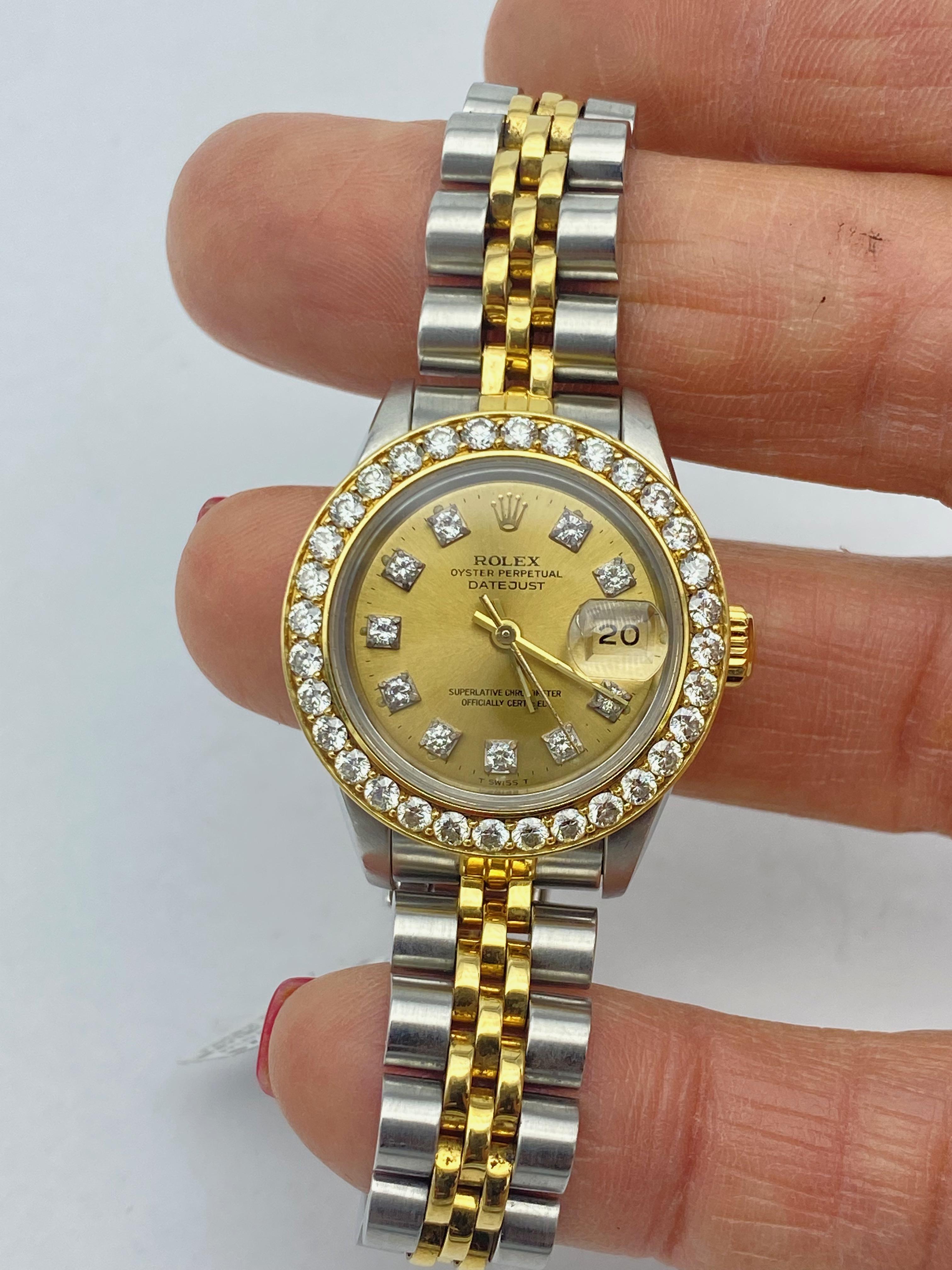 Rolex 69173 Ladies Datejust 2-Tone Watch 1.90 Ct Bezel
Beautiful and quality pre-owned Ladies Rolex in great condition. 
Pre-Owned Rolex Datejust (69173) self-winding automatic watch features a 26mm stainless steel case with an 18k yellow gold