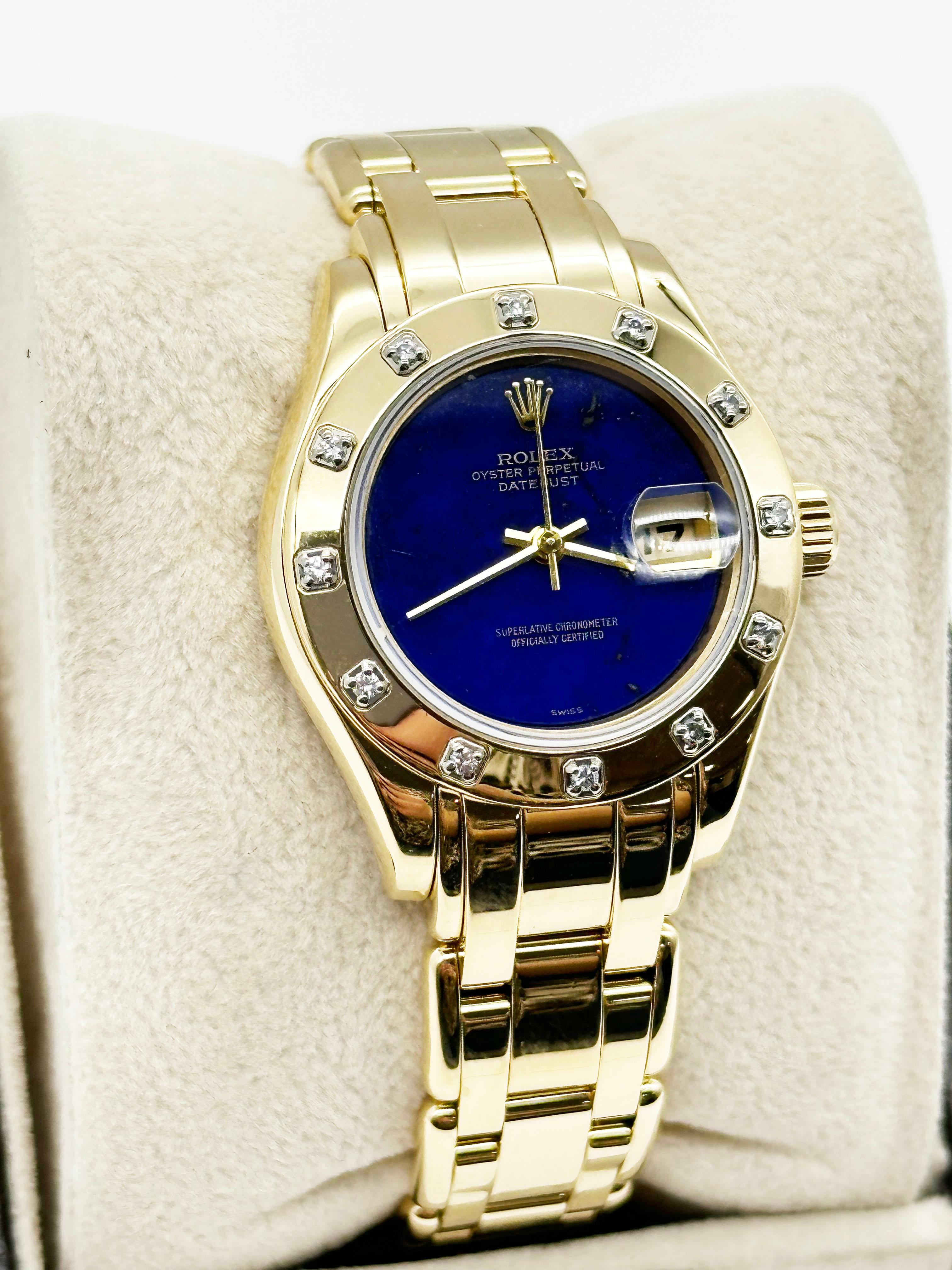 
Style Number: 69318



Serial: W033***



Year: 1995

 

Model: Ladies Pearlmaster

 

Case Material: 18K Yellow Gold

 

Band: 18K Yellow Gold

 

Bezel: 18K Yellow Gold

 

Dial: Original VERY RARE Lapis Lazuli Dial 

 

Face: Sapphire Crystal 

