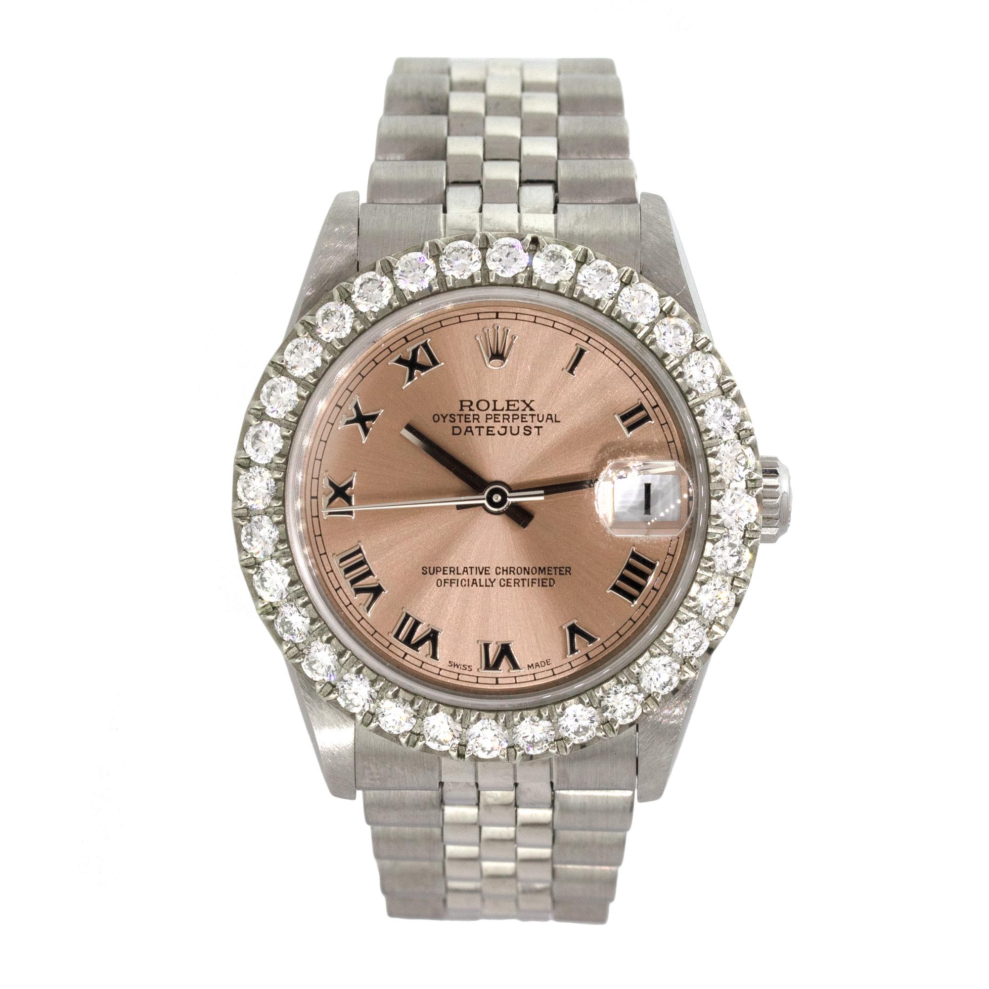 Brand: Rolex
MPN: 78274
Model: Datejust
Case Material: Stainless Steel
Case Diameter: 31mm
Crystal: Sapphire crystal
Bezel: Aftermarket Diamond bezel
Dial: Salmon dial with Roman Numerals
Bracelet: Stainless steel Jubilee band
Size: Will fit a 5.5