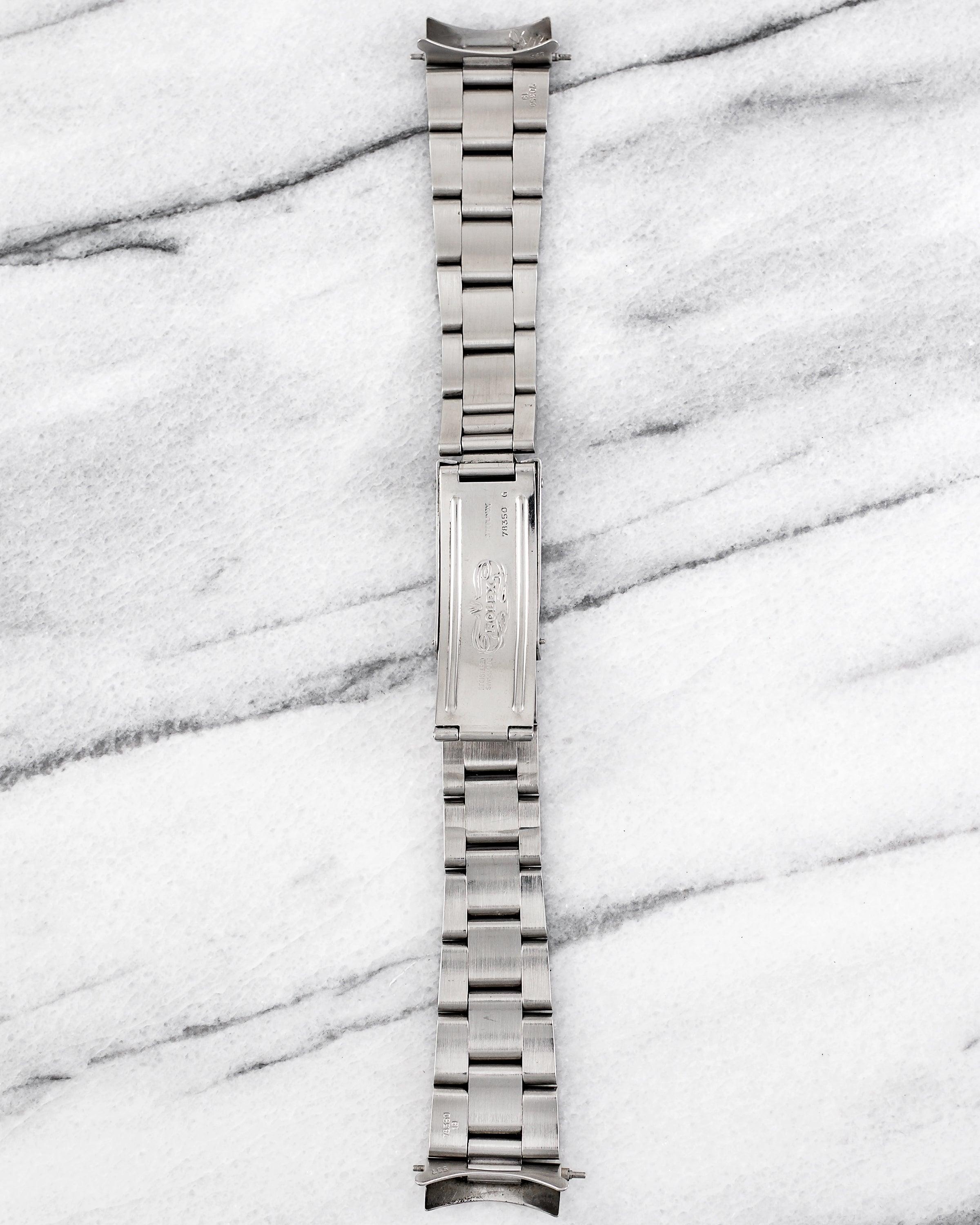 Ecco un bracciale Oyster pesante Rolex vintage con codice 78350 degli anni '90, con larghezza delle anse di 19 mm. Realizzato in acciaio inossidabile spazzolato, si adatta a casse Rolex da 34 mm come l'Air-King e l'Oyster Perpetual Date. Codice