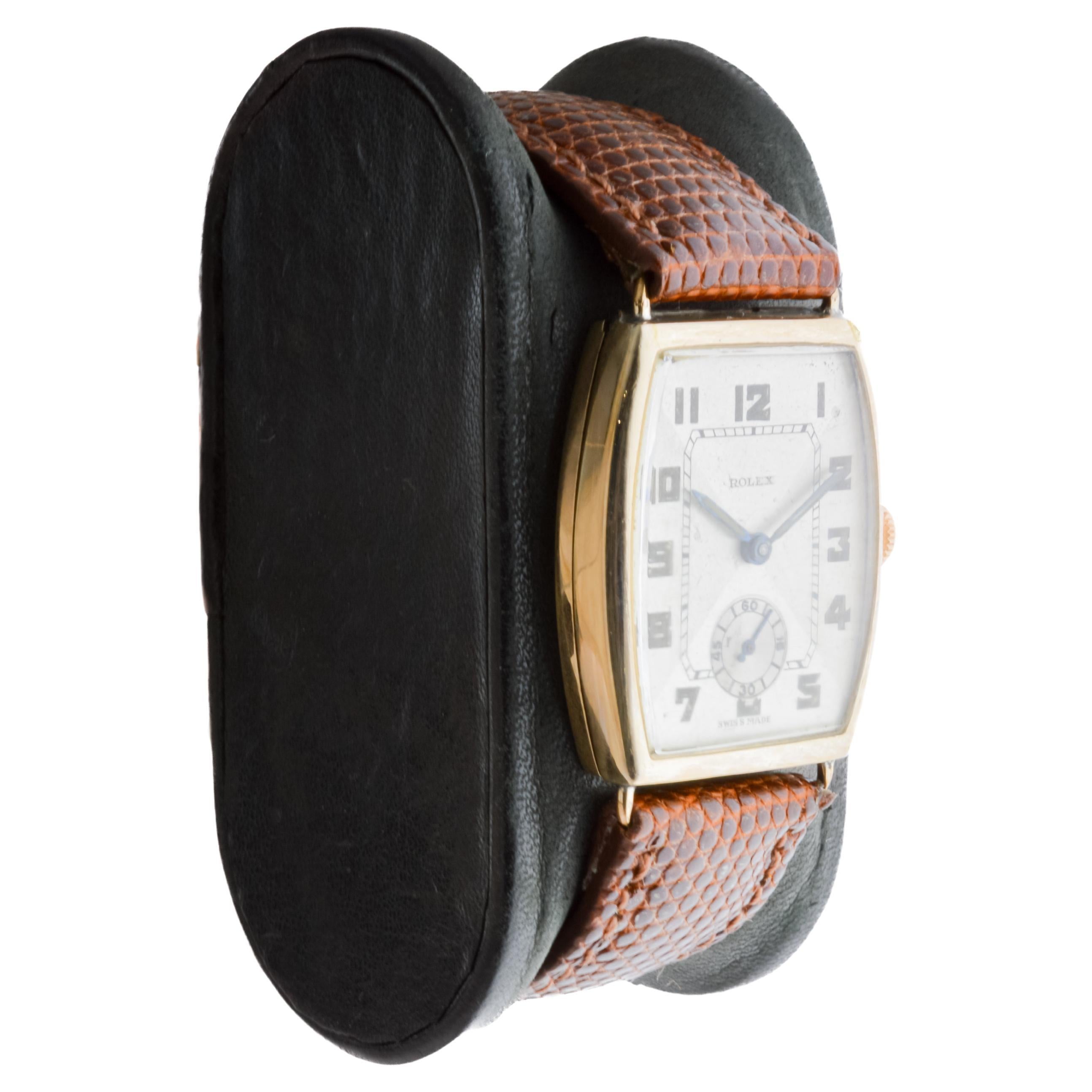 FACTORY / HOUSE: Rolex Watch Company
STYLE / REFERENCE: Tonneau Shaped / Reference 324
METAL / MATERIAL: 9Kt Solid Gold
CIRCA / YEAR: 1938
DIMENSIONS / SIZE: Length 35mm X Diameter 25mm
MOVEMENT / CALIBER: Manual Winding / 15 Jewels / Caliber 
DIAL