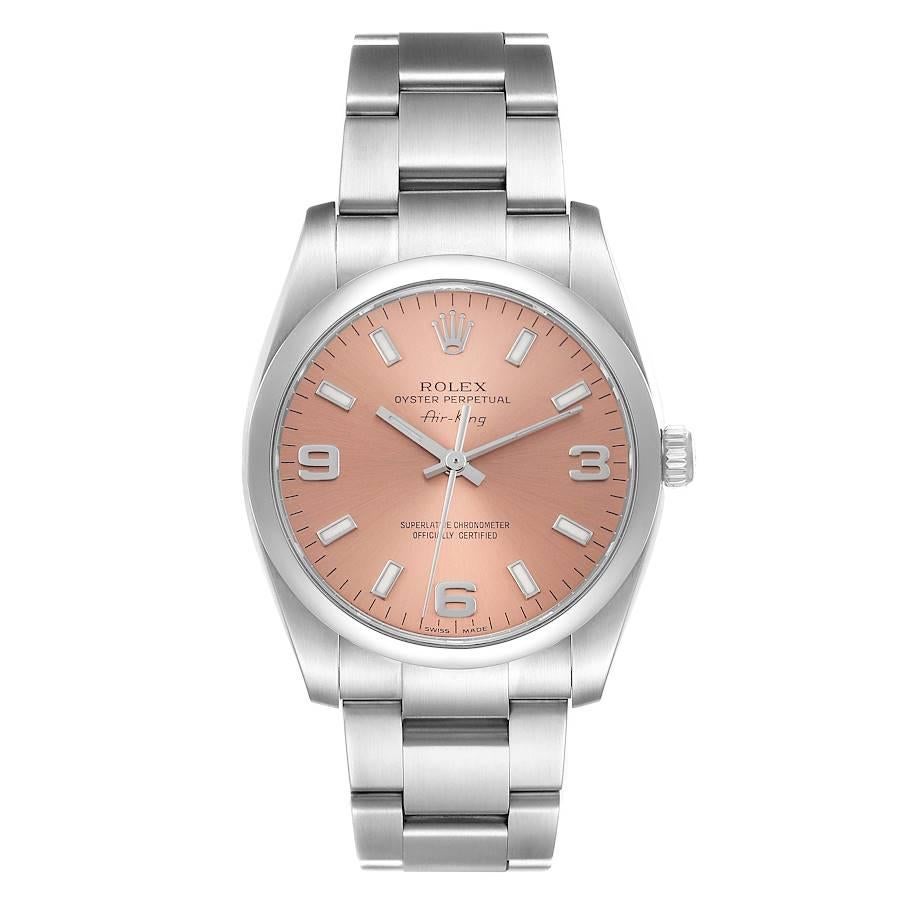 Rolex Air King 34 Lachs Zifferblatt glatte Lünette Herrenuhr 114200 Box Card. Offiziell zertifiziertes Chronometerwerk mit automatischem Aufzug. Gehäuse aus Edelstahl mit einem Durchmesser von 34.0 mm.  Rolex Logo auf einer Krone. Glatte, gewölbte
