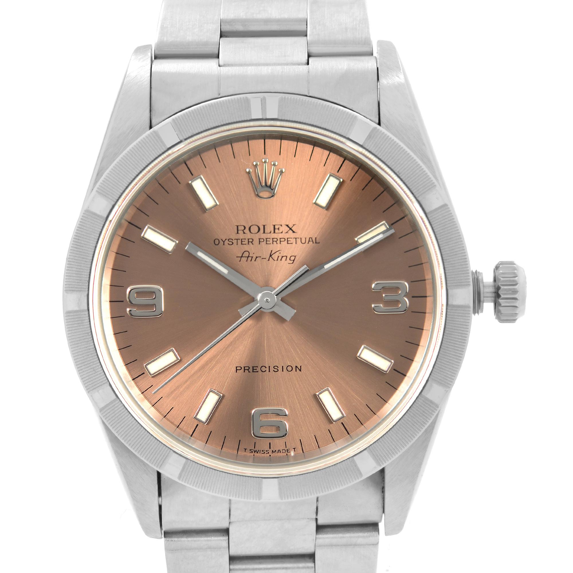 Pre-owned Rolex Air-King 34mm No holes case Stainless Steel Salmon Dial Automatic Men's Watch 14010. This Beautiful Timepiece was Produced in 1996 is Powered by Mechanical ( Automatic ) Movement And Features: Round Stainless Steel Case with a