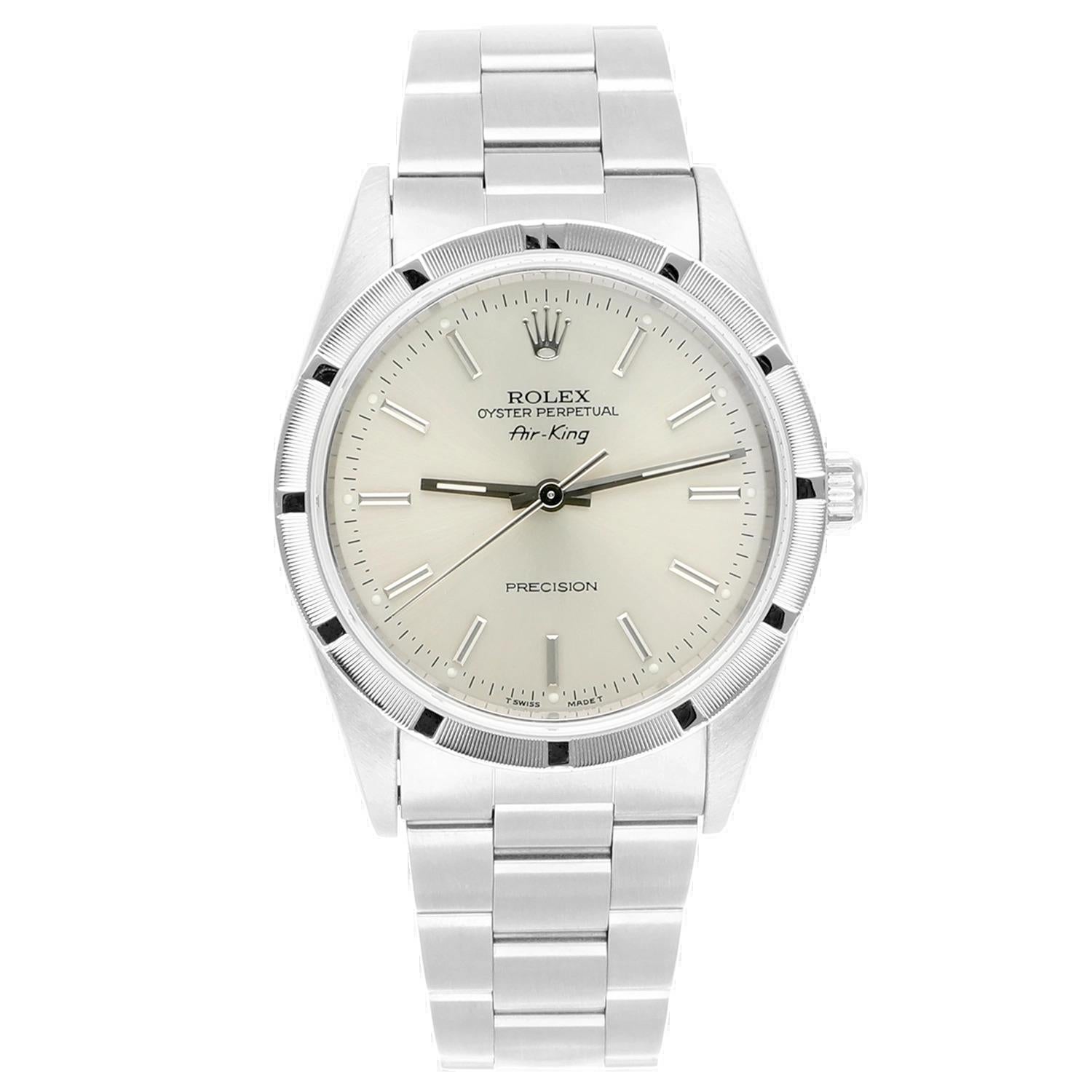 Rolex Air King 34mm Silver Dial Engine Turned Bezel Steel Mens Watch 14010, Circa 1996
This watch has been professionally polished, serviced and is in excellent overall condition. There are absolutely no visible scratches or blemishes. Authenticity