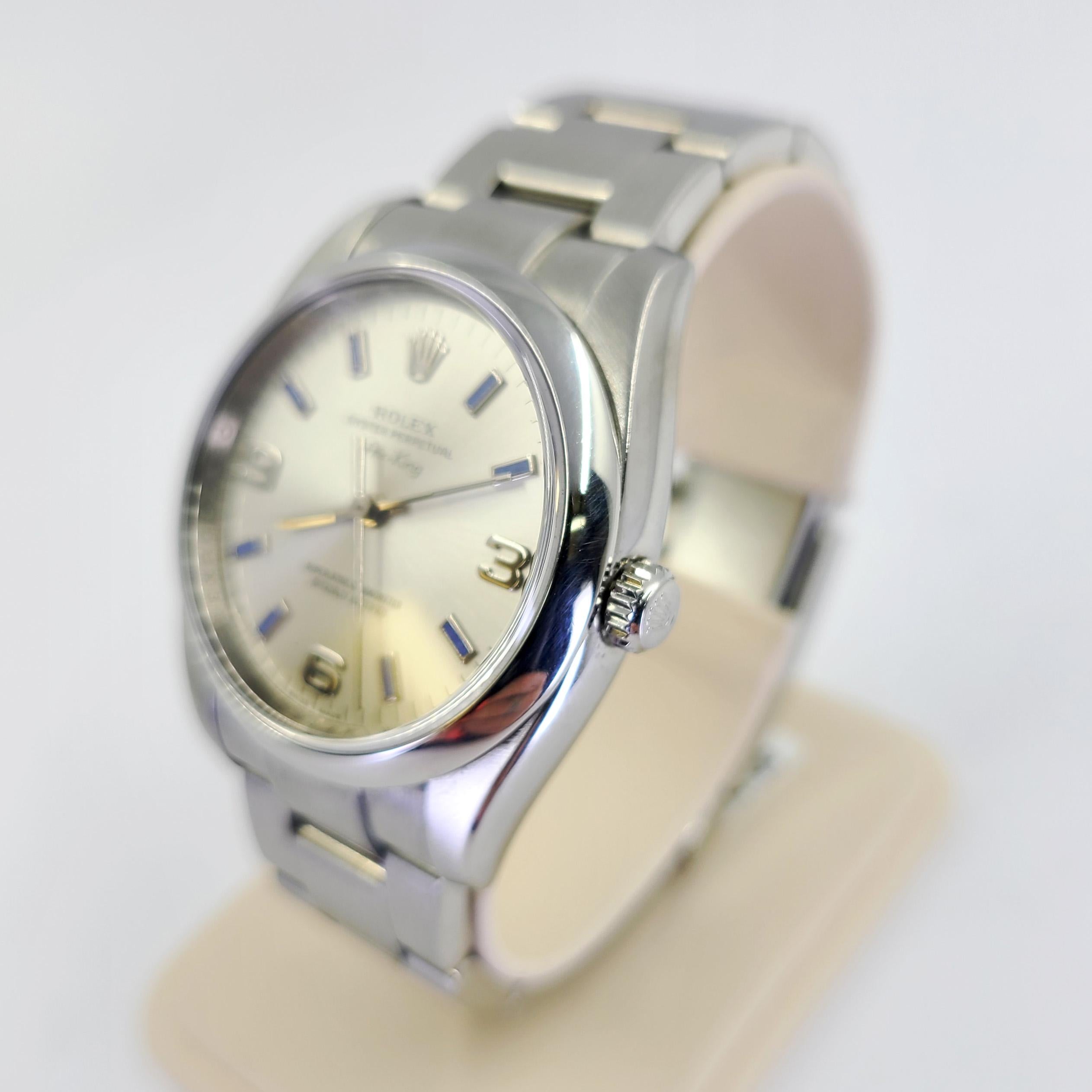 Pre-owned Rolex Oyster Perpetual Air-King 34mm Automatic Wristwatch in Steel with Silver Dial & Light Blue Markers On Brushed Oyster Bracelet. Model #114200, M Serial Number Circa 2008. Includes 1 Year Timekeeping Warranty.