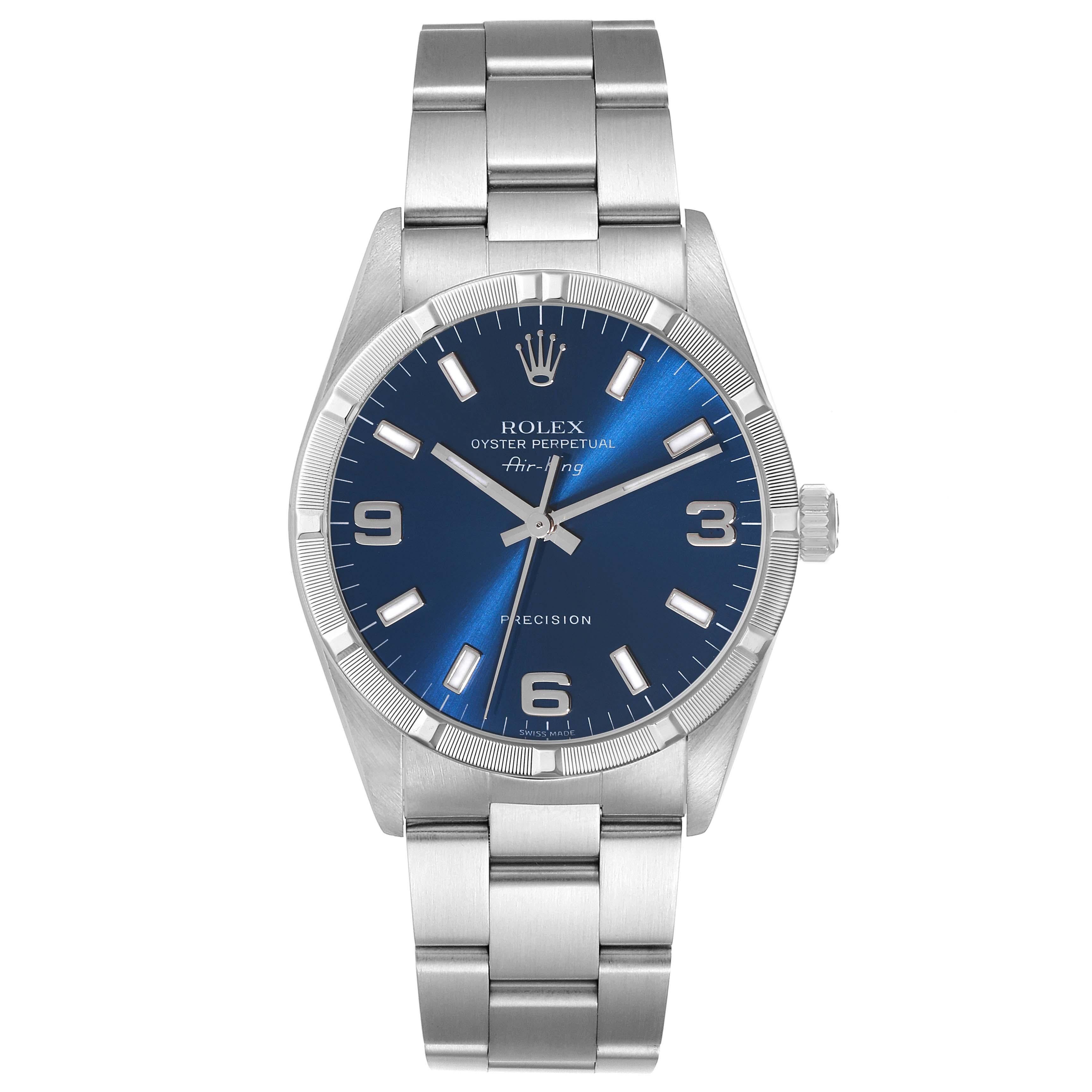 Rolex Air King Blue Dial Engine Turned Bezel Steel Mens Watch 14010. Automatic self-winding movement. Stainless steel case 34 mm in diameter. Rolex logo on the crown. Stainless steel engine turned bezel. Scratch resistant sapphire crystal. Blue dial