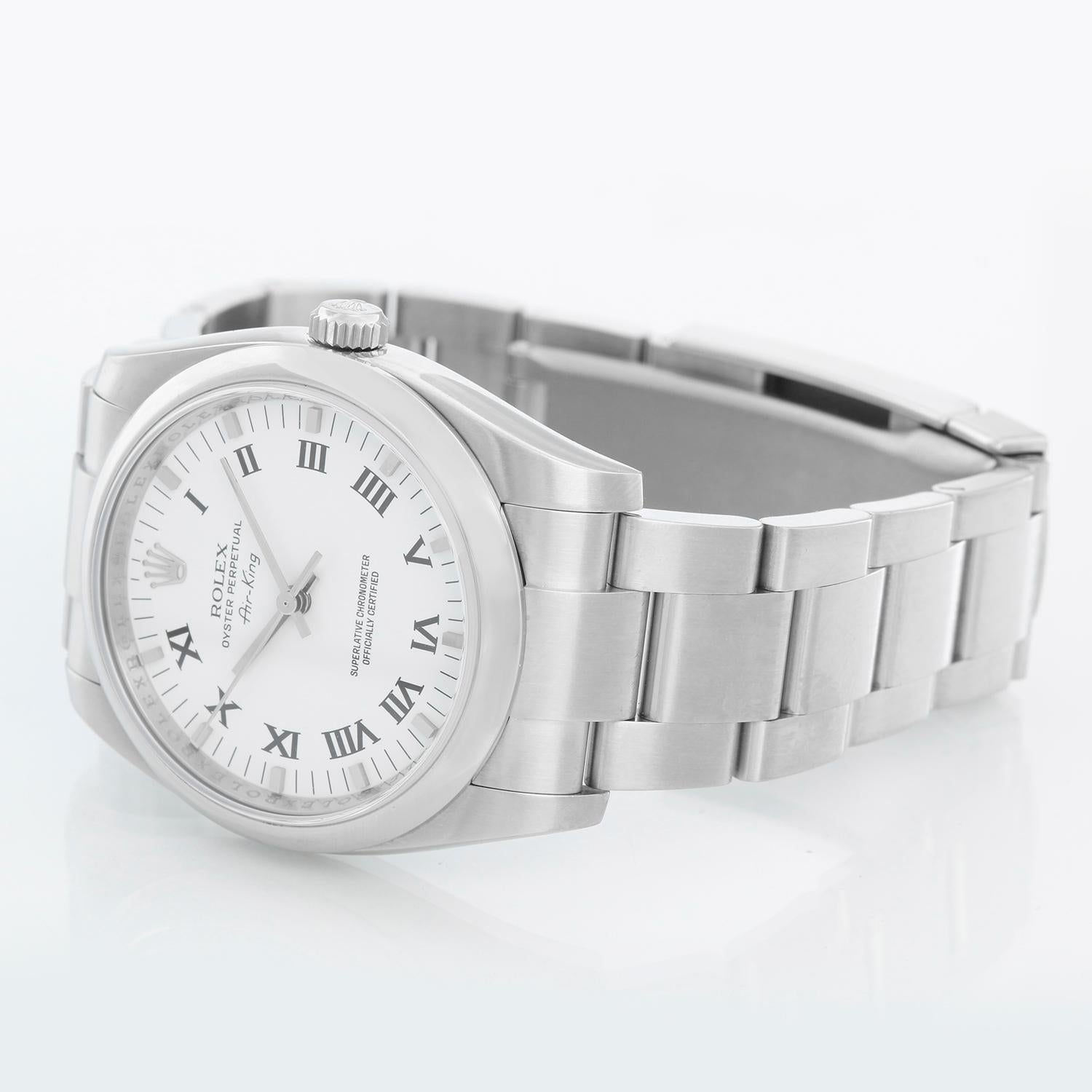 Rolex Air-King Men's Stainless Steel White Dial Watch 114200 - Automatic winding, 31 jewels, no-date, sapphire crystal. Stainless steel case with stainless steel smooth bezel (34mm diameter). White dial with black roman numerals. Stainless steel