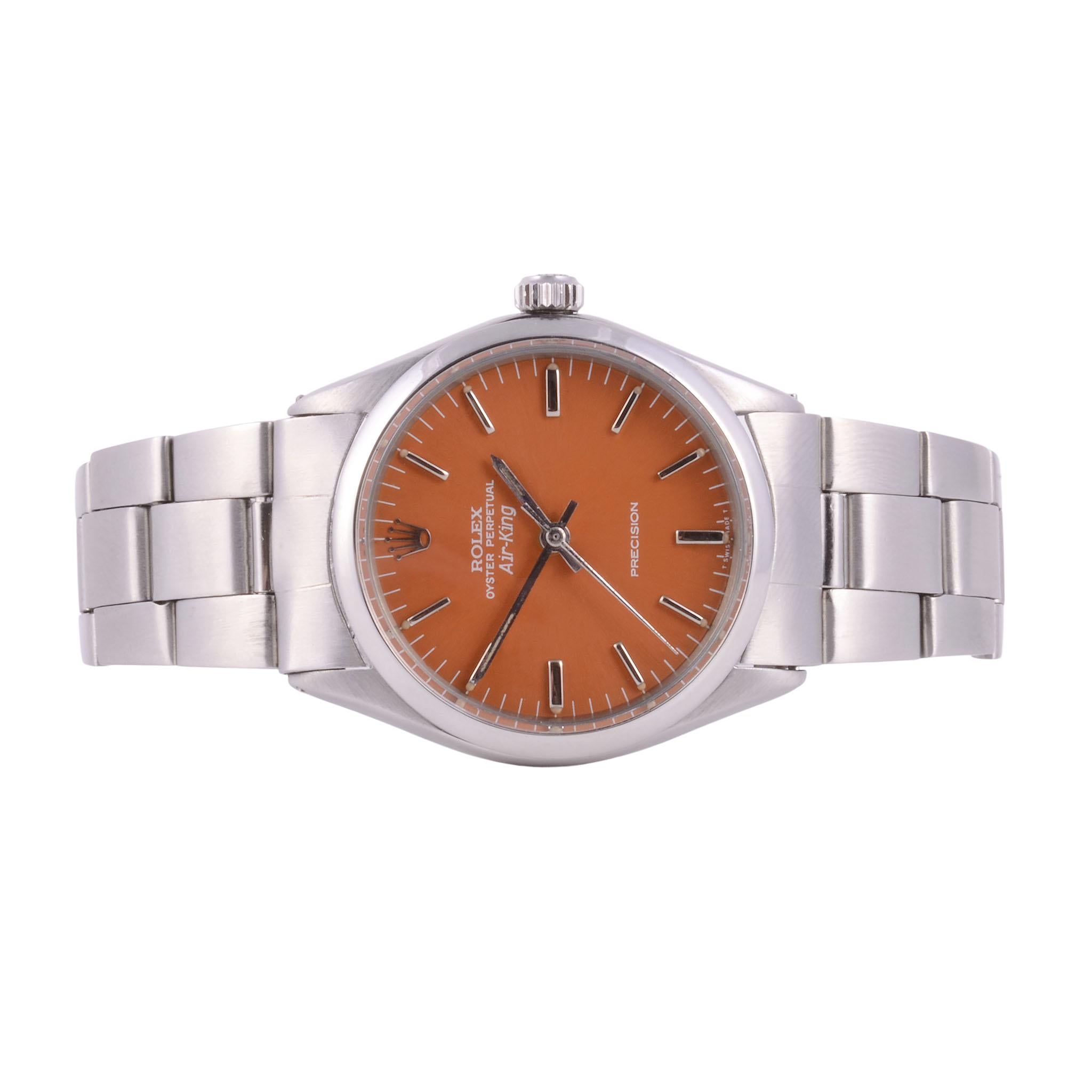 Vintage Rolex Air King orange dial wrist watch, circa 1969-70. This vintage Rolex Air King wrist watch features a steel case with custom orange restored original dial with baton markers, and a 26 jewel perpetual movement. The steel Rolex is in