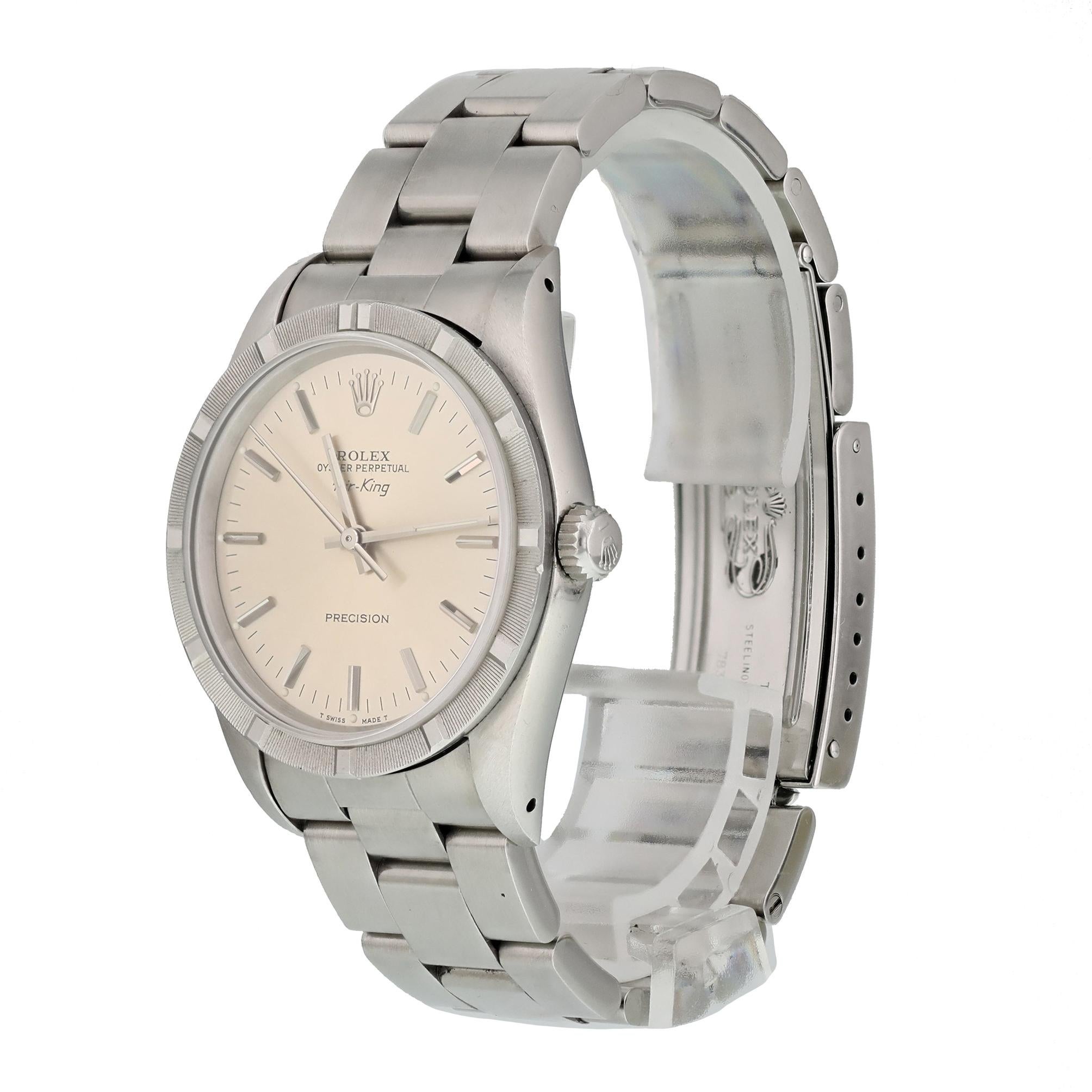 Rolex Air-King Precision 14010 Men's Watch. 
34mm Stainless Steel case. 
Stainless Steel engine turn bezel. 
Silver dial with Luminous Steel hands and index hour markers. 
Minute markers on the outer dial. 
Stainless Steel Bracelet with Fold Over