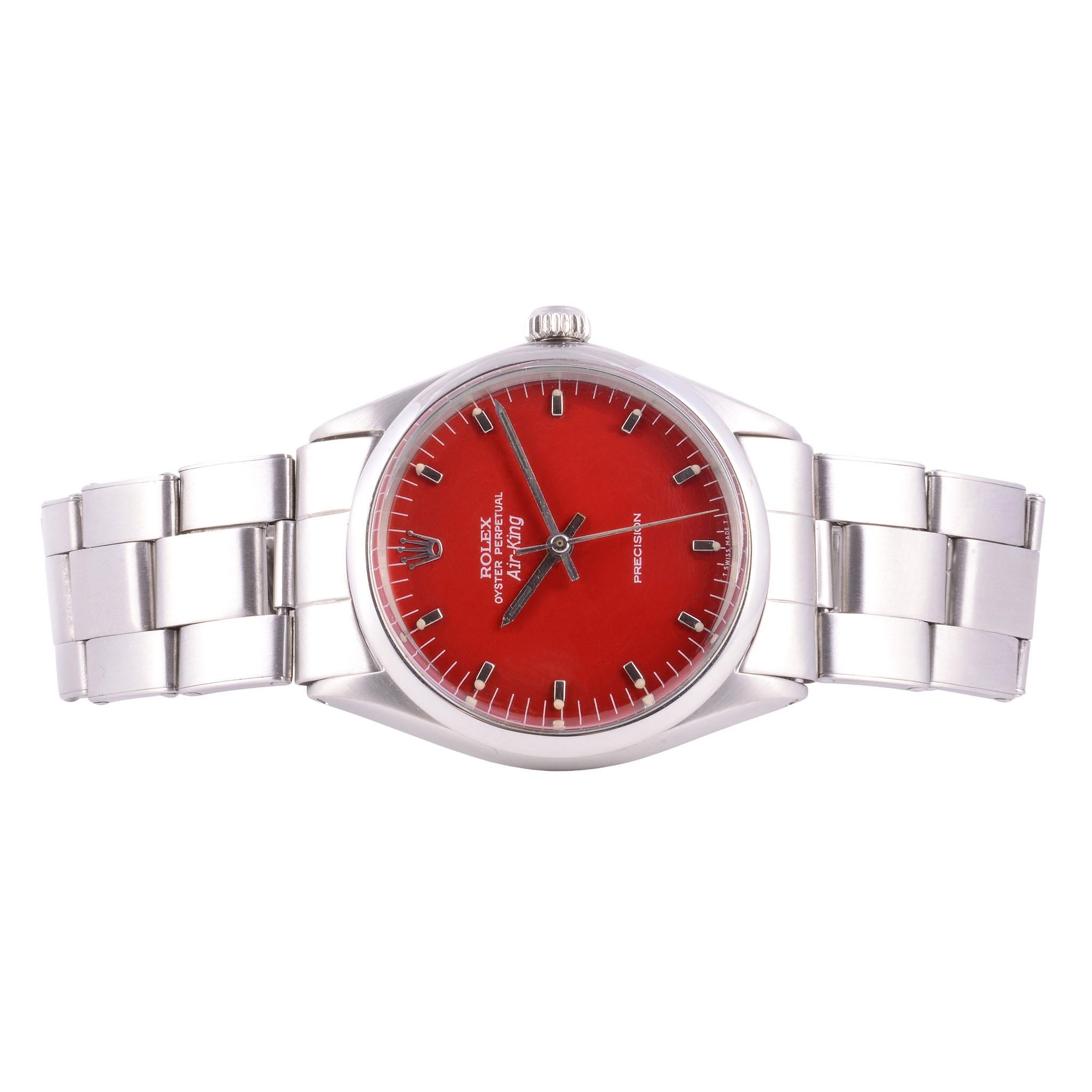 Vintage Rolex Air King red dial wrist watch, circa 1970. This steel Rolex watch features a custom red restored original dial and a 26 jewel perpetual movement. The Rolex Air King is in excellent condition. Cal 1500, Case #2453429, Ref #5500. [JVSS