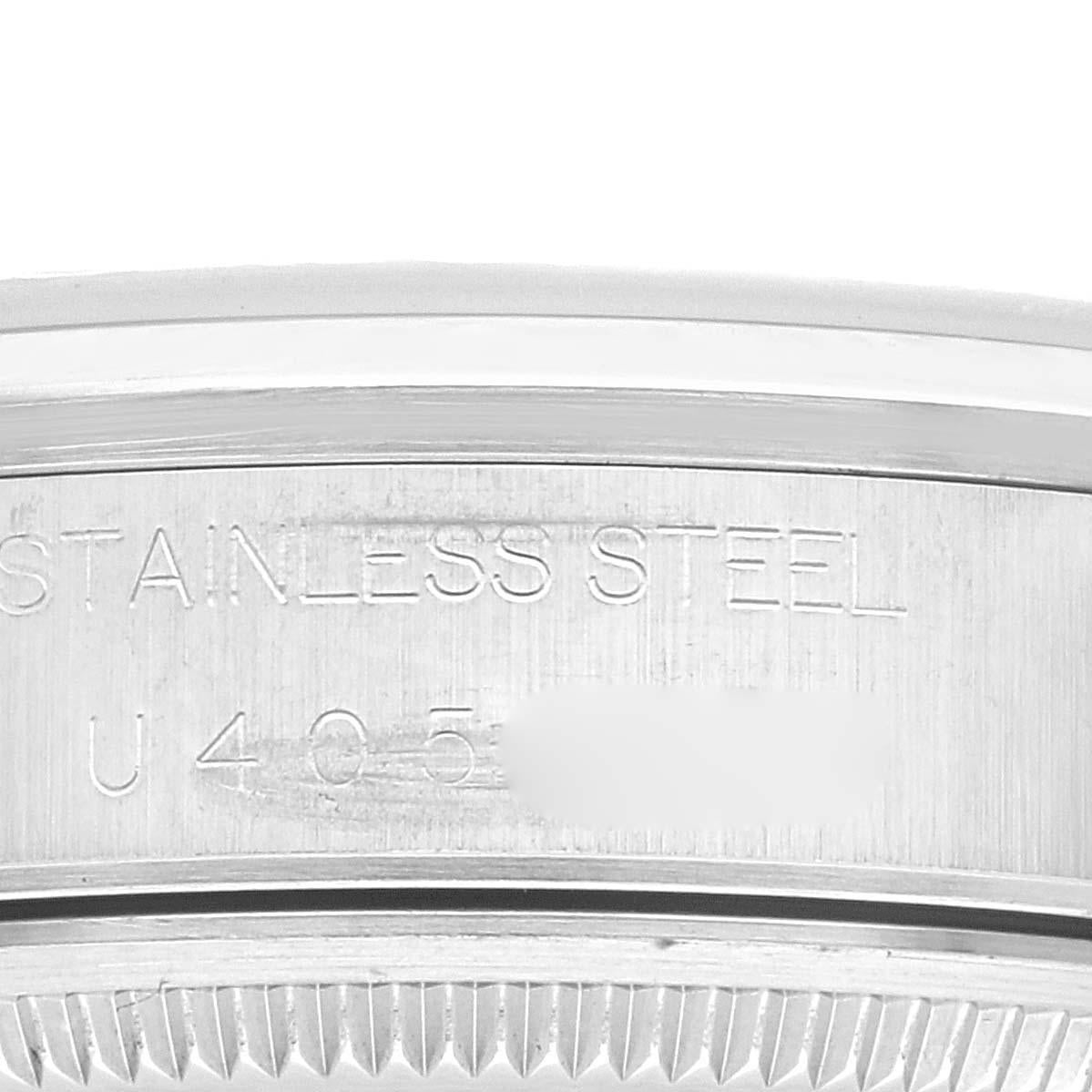 Rolex Air King Lachs Zifferblatt glatte Lünette Stahl Herrenuhr 14000. Automatisches Uhrwerk mit Selbstaufzug. Gehäuse aus Edelstahl mit einem Durchmesser von 34 mm. Rolex Logo auf der Krone. Glatte Lünette aus Edelstahl. Kratzfestes Saphirglas.
