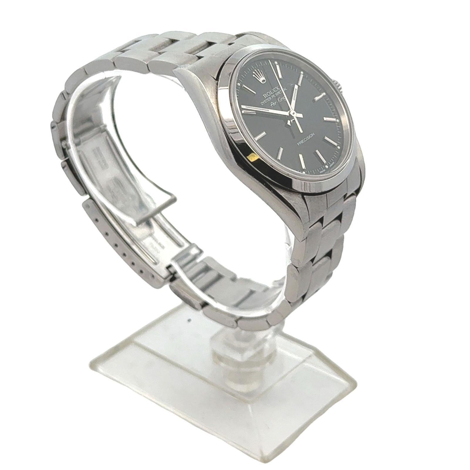 This stainless steel Rolex Air-King features a smooth bezel and an oyster bracelet, offering a sleek and classic design. The 34mm case is paired with a bold black dial, showcasing the iconic simplicity and precision Rolex is known for. With the