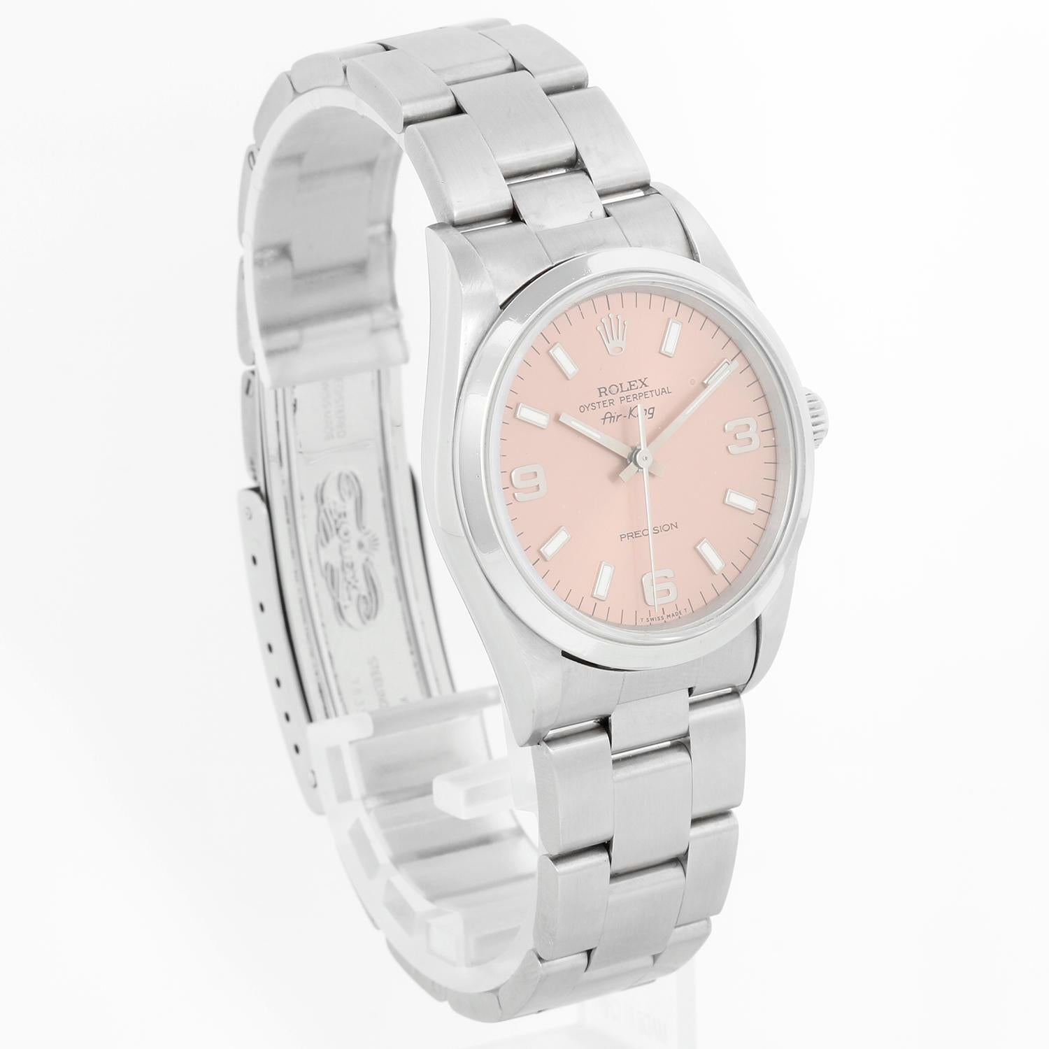 Rolex Air-King Men's Stainless Steel 14000 - Automatic winding, 27 jewels, no-date, sapphire crystal. Stainless steel case with smooth bezel (33mm diameter). Salmon dial with Arabic numerals and index markers. Stainless steel Oyster bracelet.