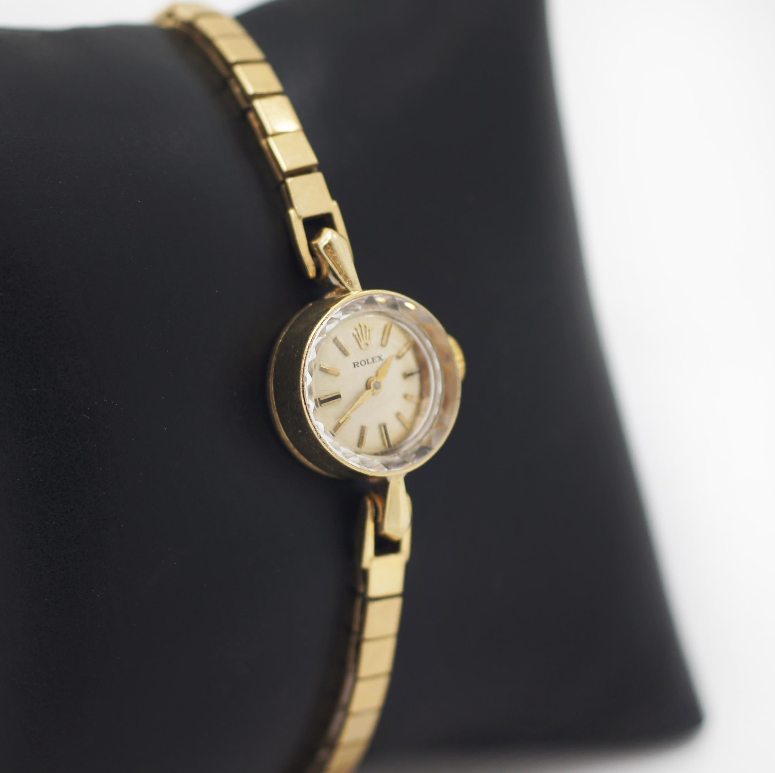 Rolex
14K Yellow Gold
Vintage 1960s
Swiss Made
Original golden dial with golden markers and hands, 
Rolex crown motif at 12 o'clock
Movement Manual winding
Movement: Caliber 1401
Number of jewels 17
Case in 14k yellow gold
Case approx. 15mm x 25 mm