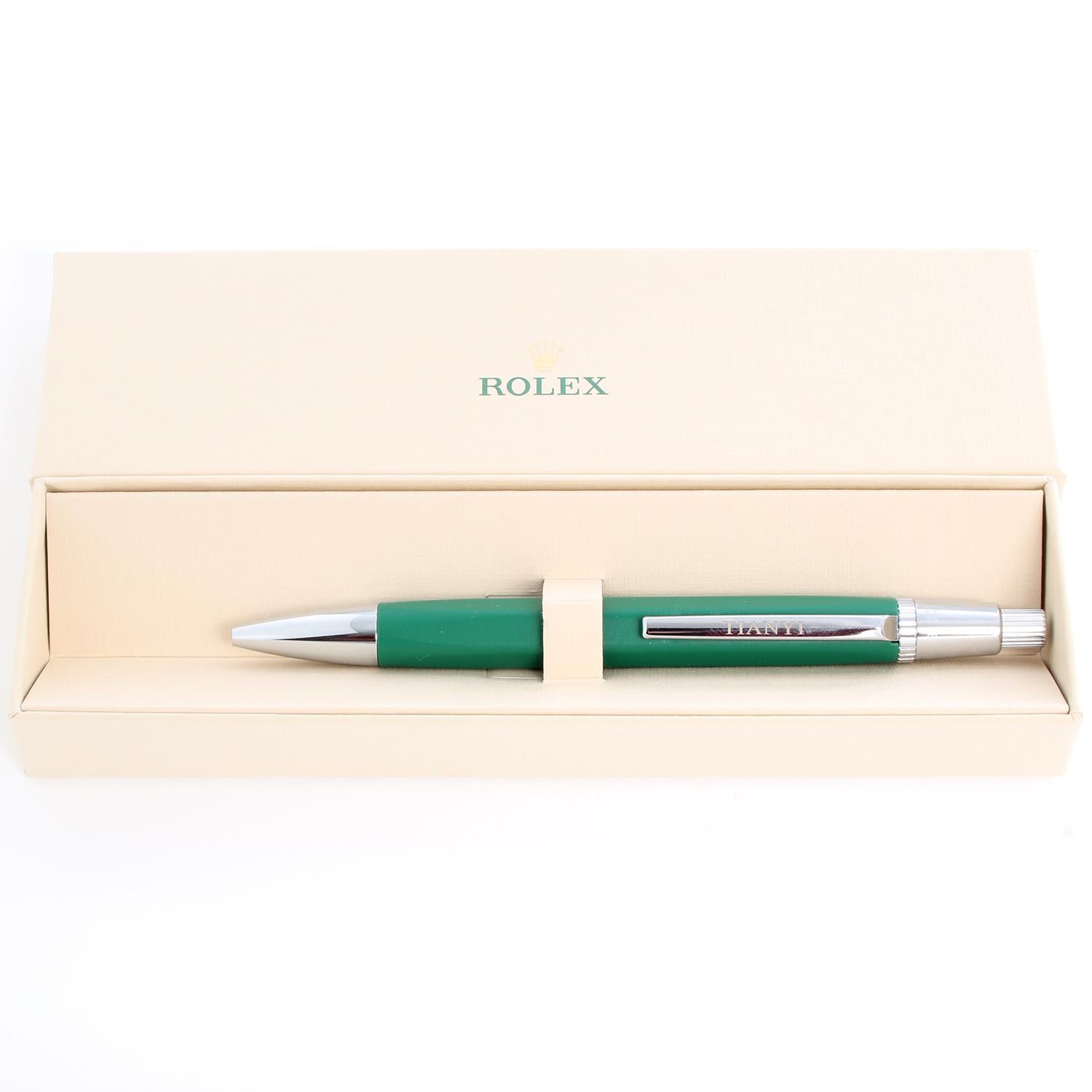 Rolex Ballpoint Push Pen - Green/ Silver Rolex pen with blue ink. Pre-owned with Rolex box. Measures 5.5 inches. Beautiful novelty gift.