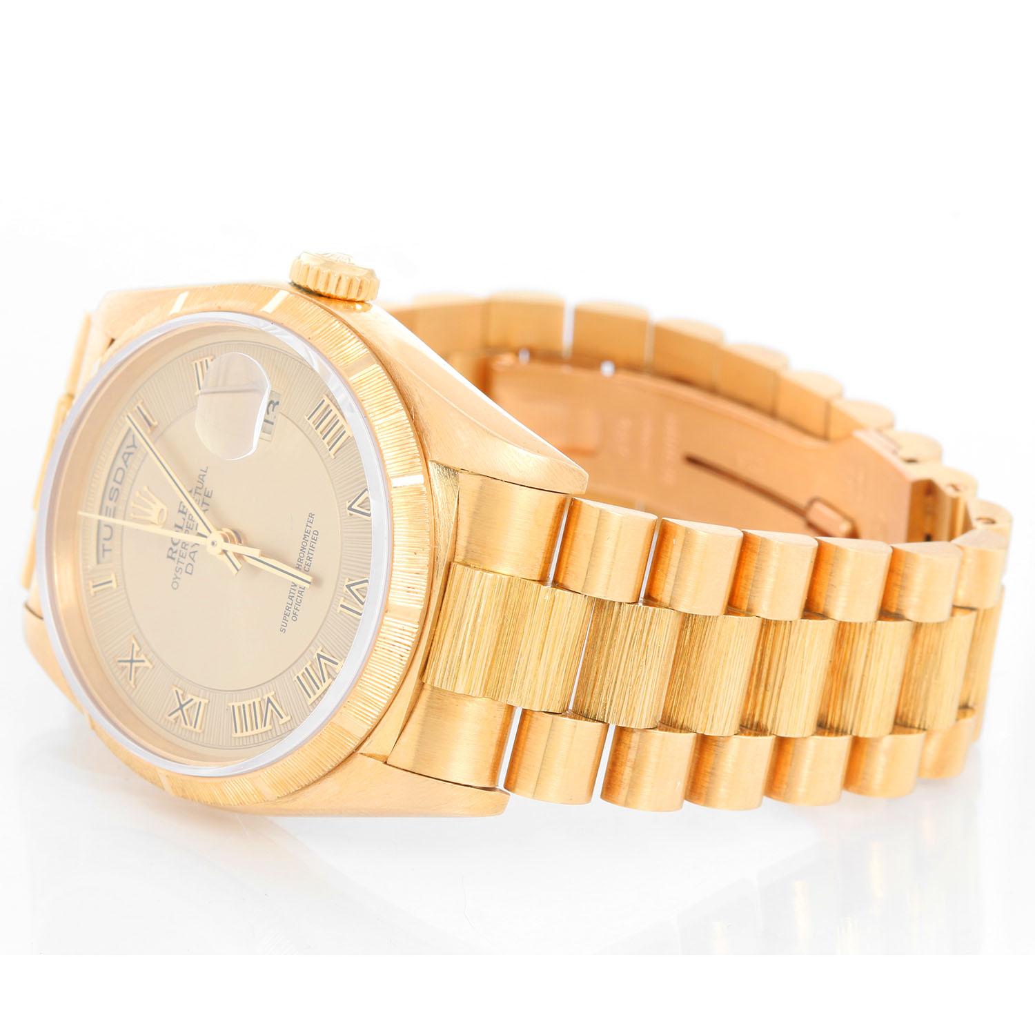 Rolex Bark President Day-Date Men's 18k Gold Watch 18248 - Automatic winding; Double quick-set; sapphire crystal. 18k yellow gold case with original barked bezel ( 36 mm ). Champagne sunburtst dial. 18k yellow gold hidden-clasp President bracelet